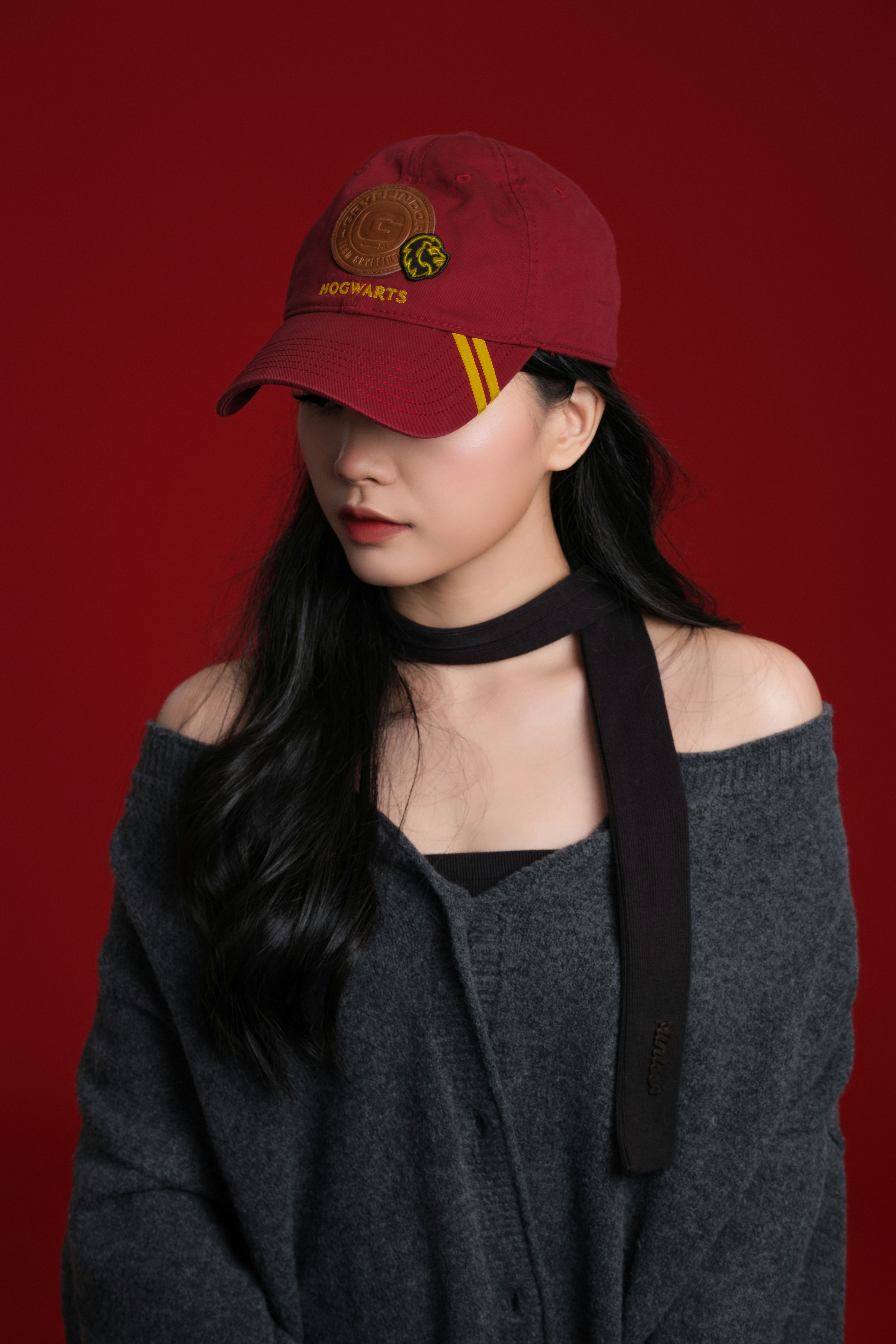 A woman wearing a red hat and a black scarf photo – Free Fashion Image ...