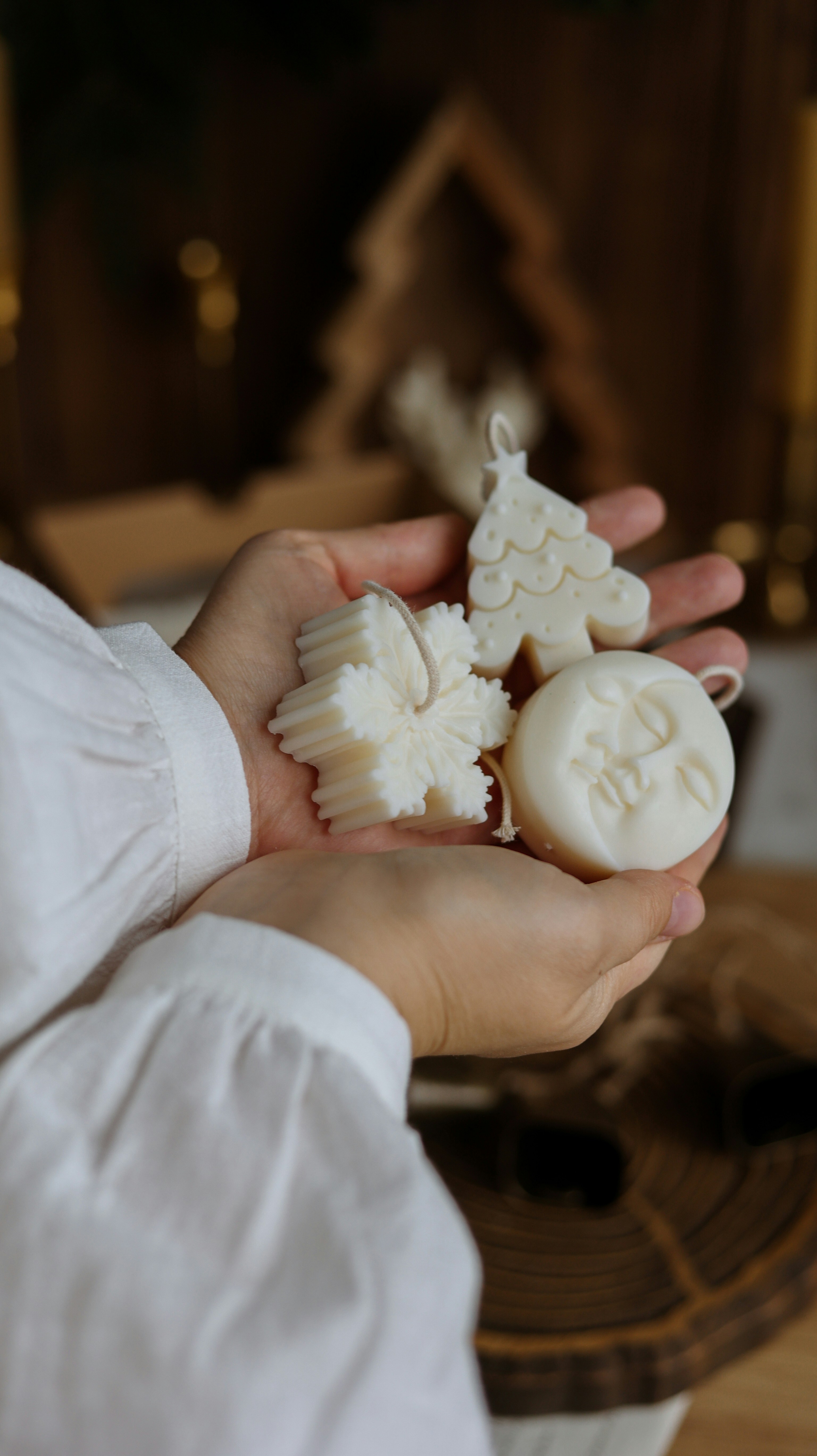 A person holding some cookies in their hands