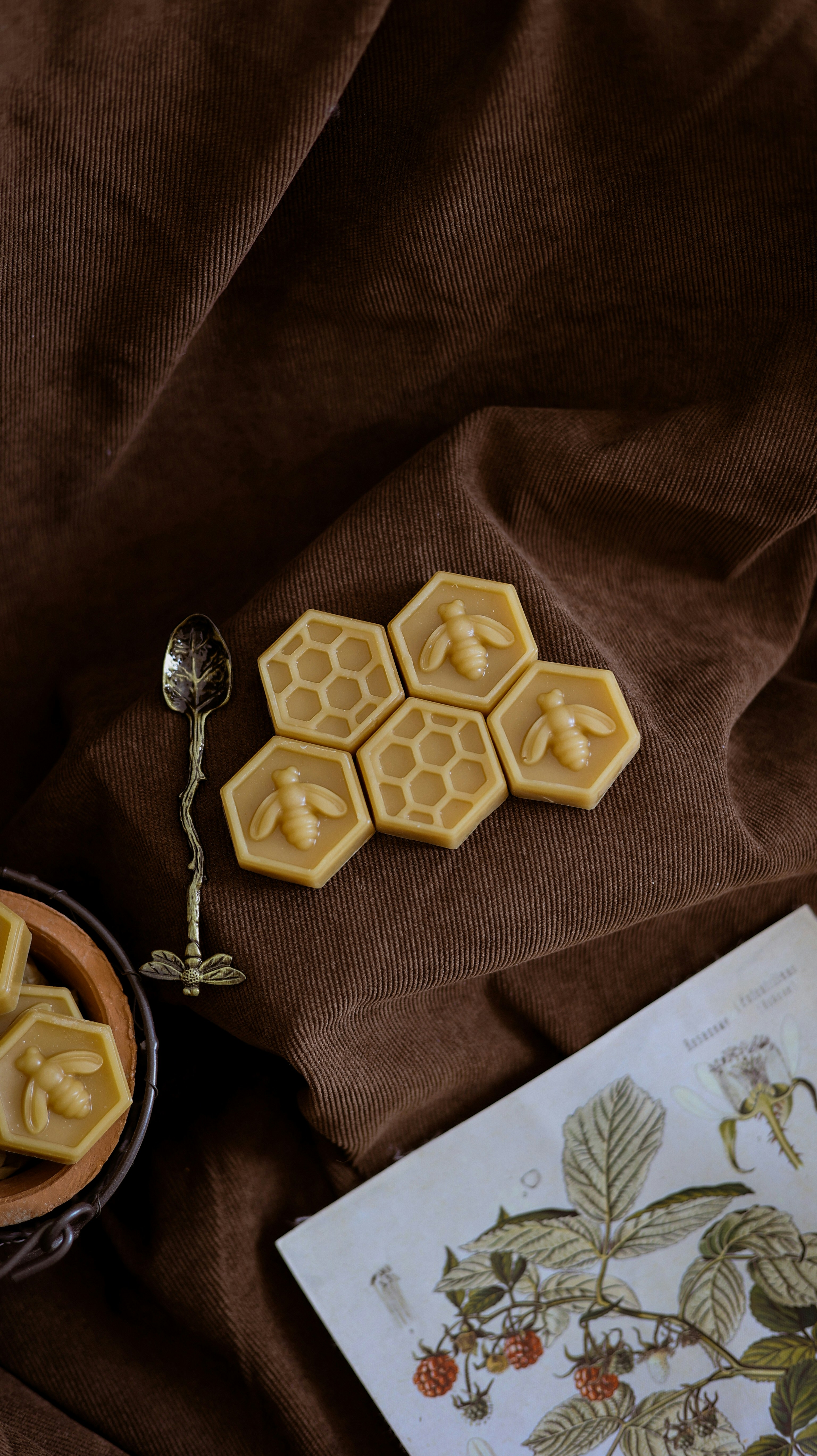 A table topped with a bowl of food and a spoon