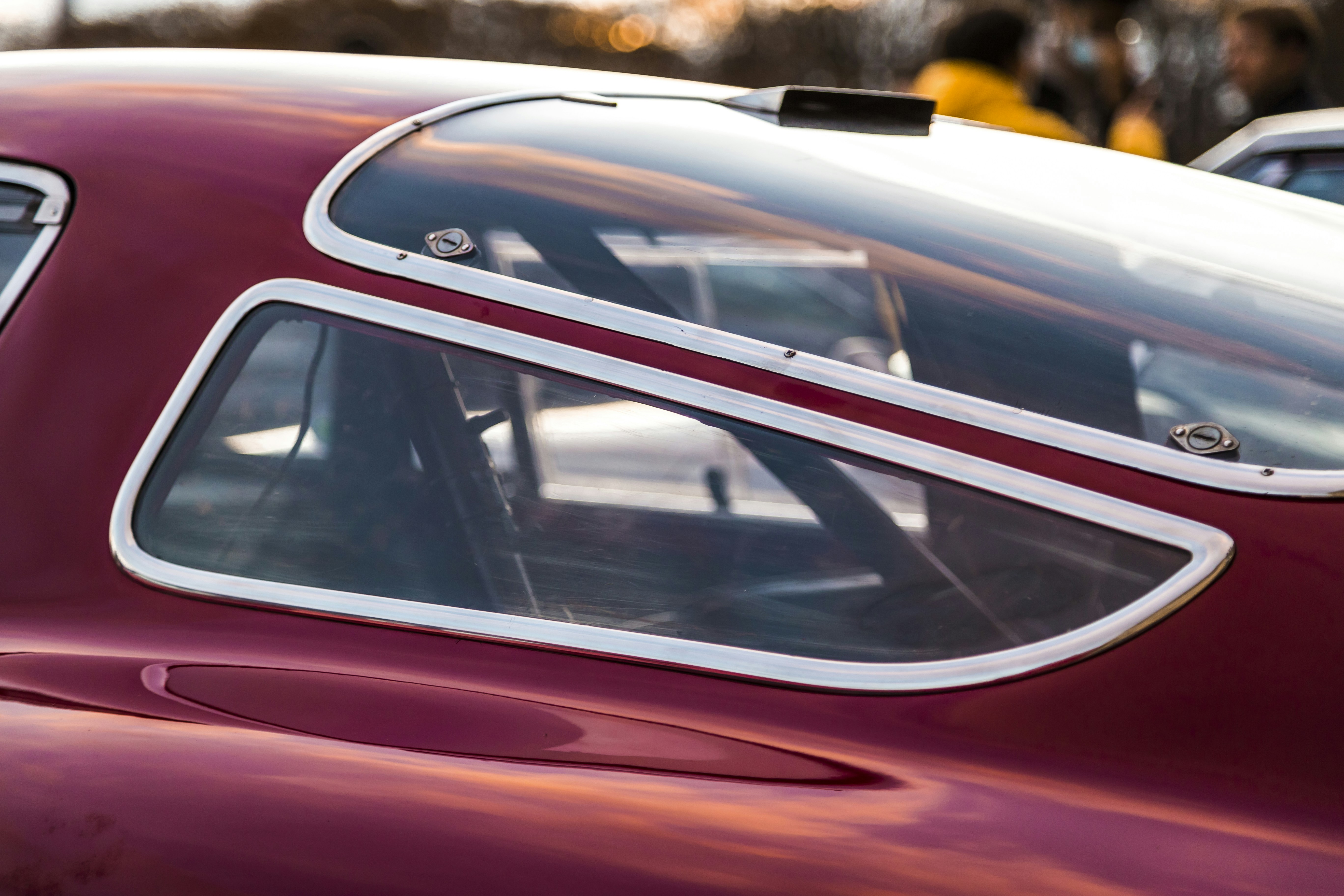A close up of a red car with white trim