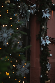 A decorated christmas tree outside of a building