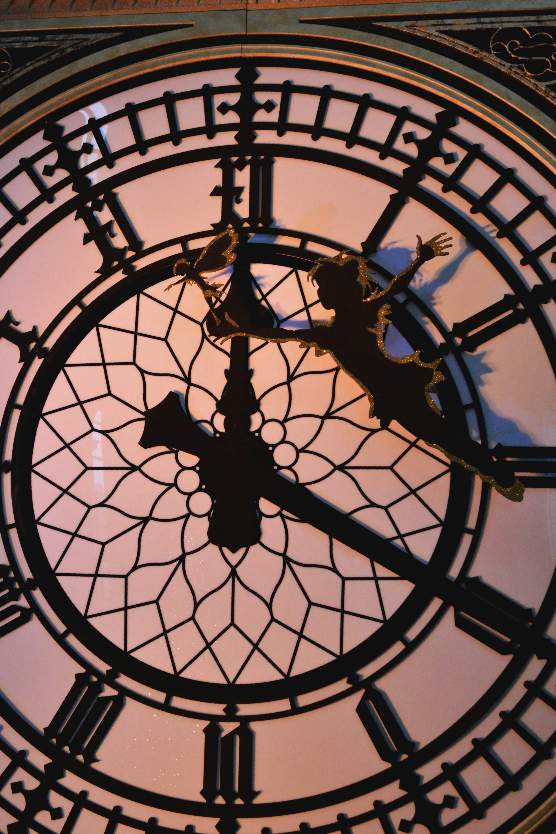 A close up of a clock with roman numerals