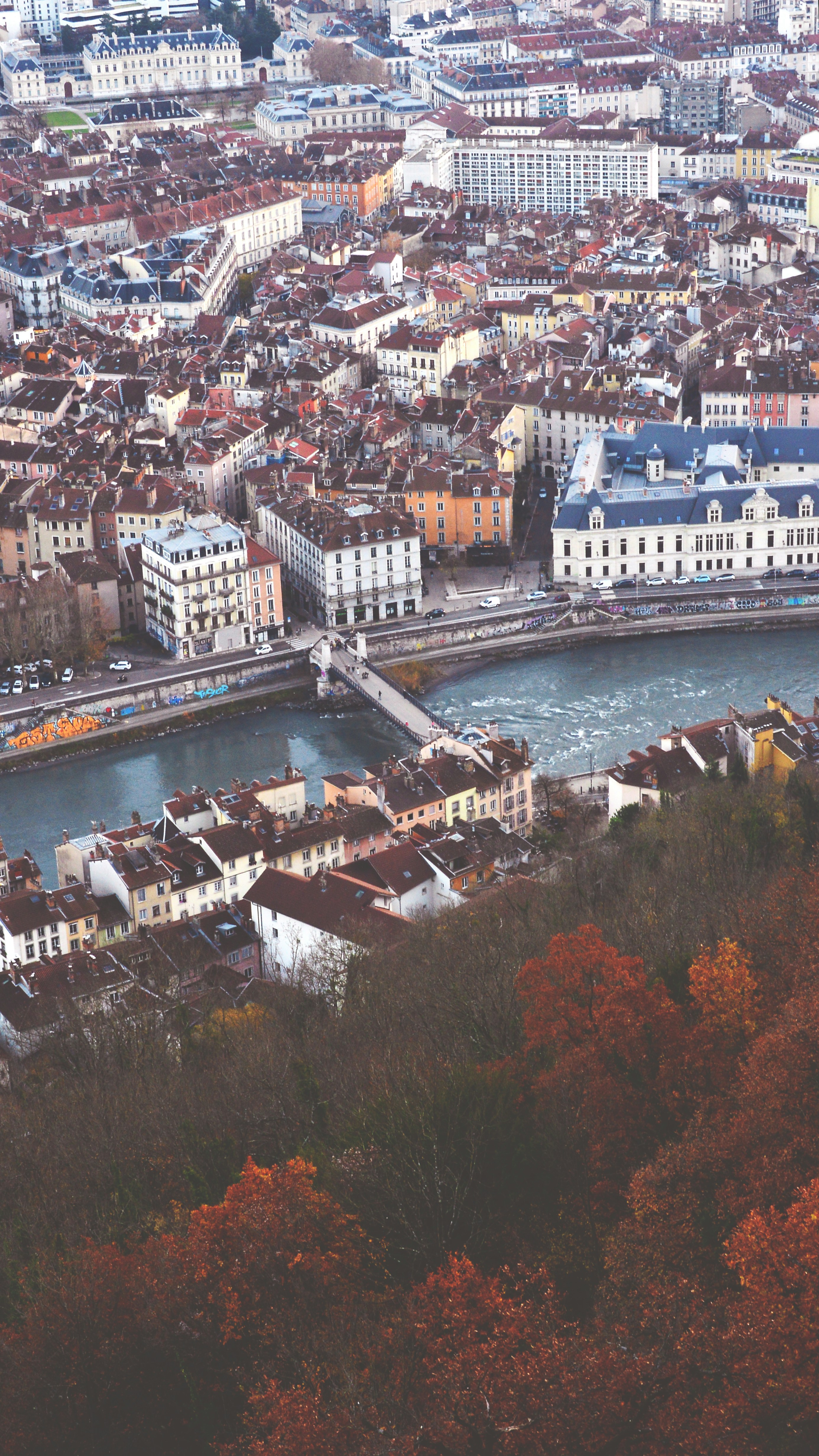 An aerial view of a city with a river running through it