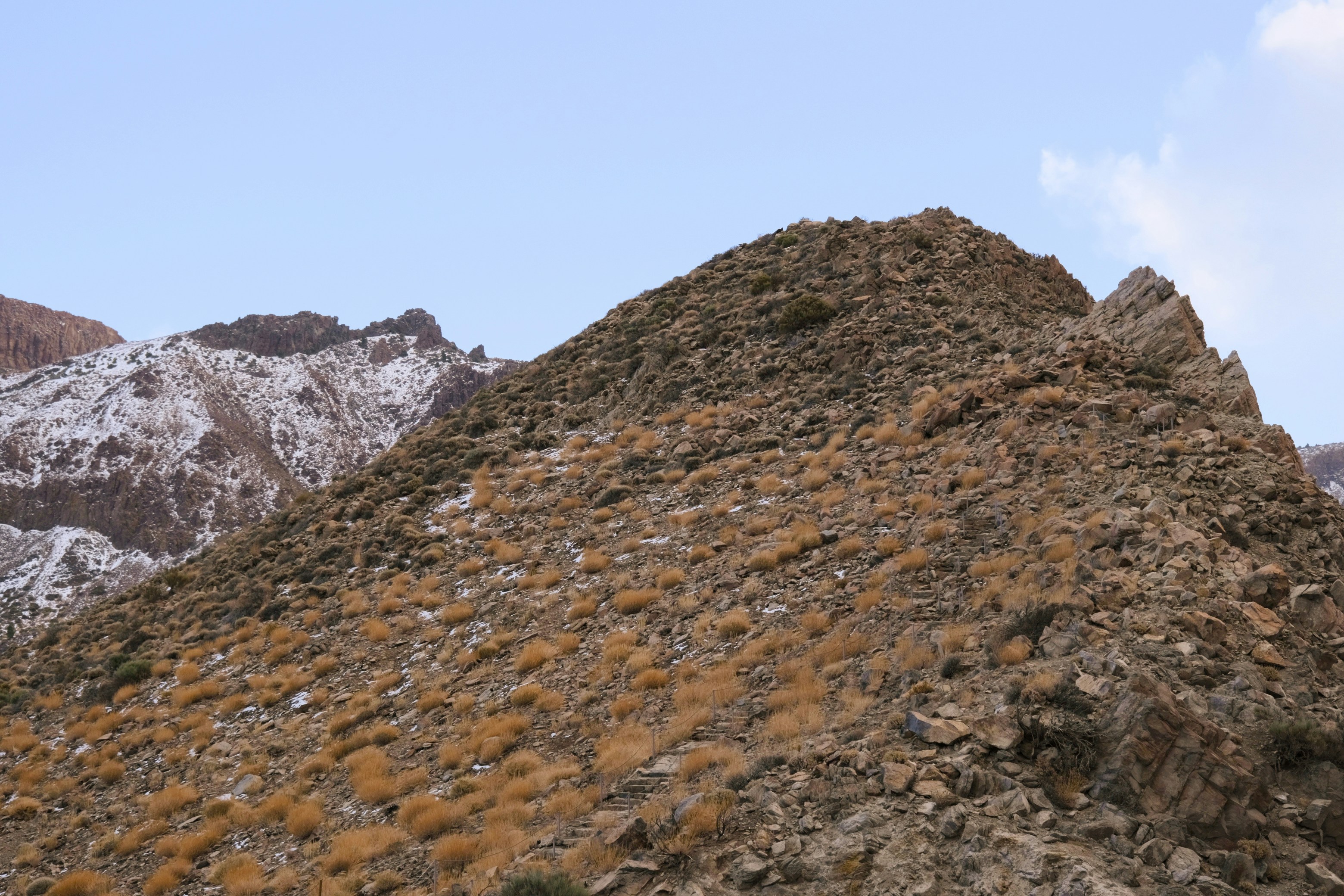A large pile of dirt sitting on top of a mountain