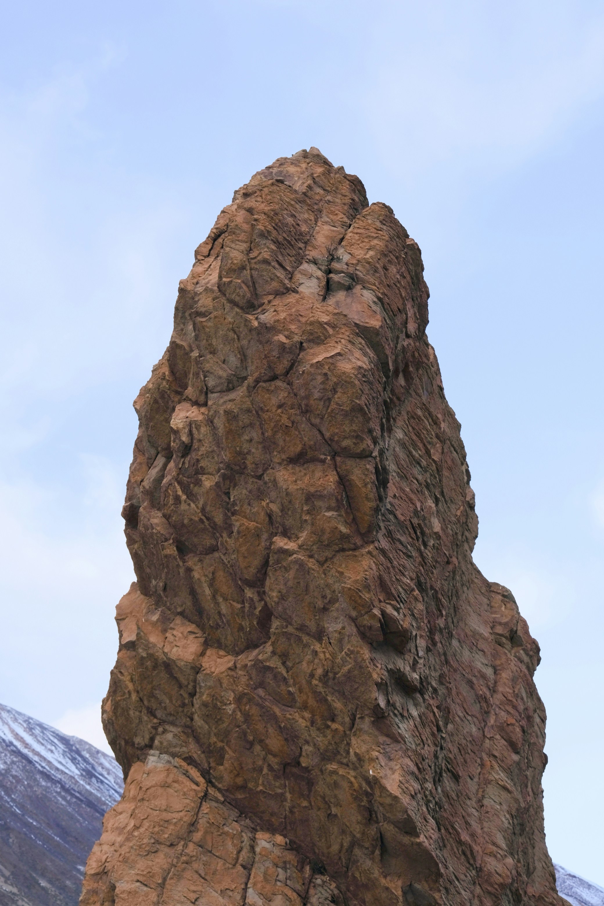 A large rock formation in the middle of a mountain