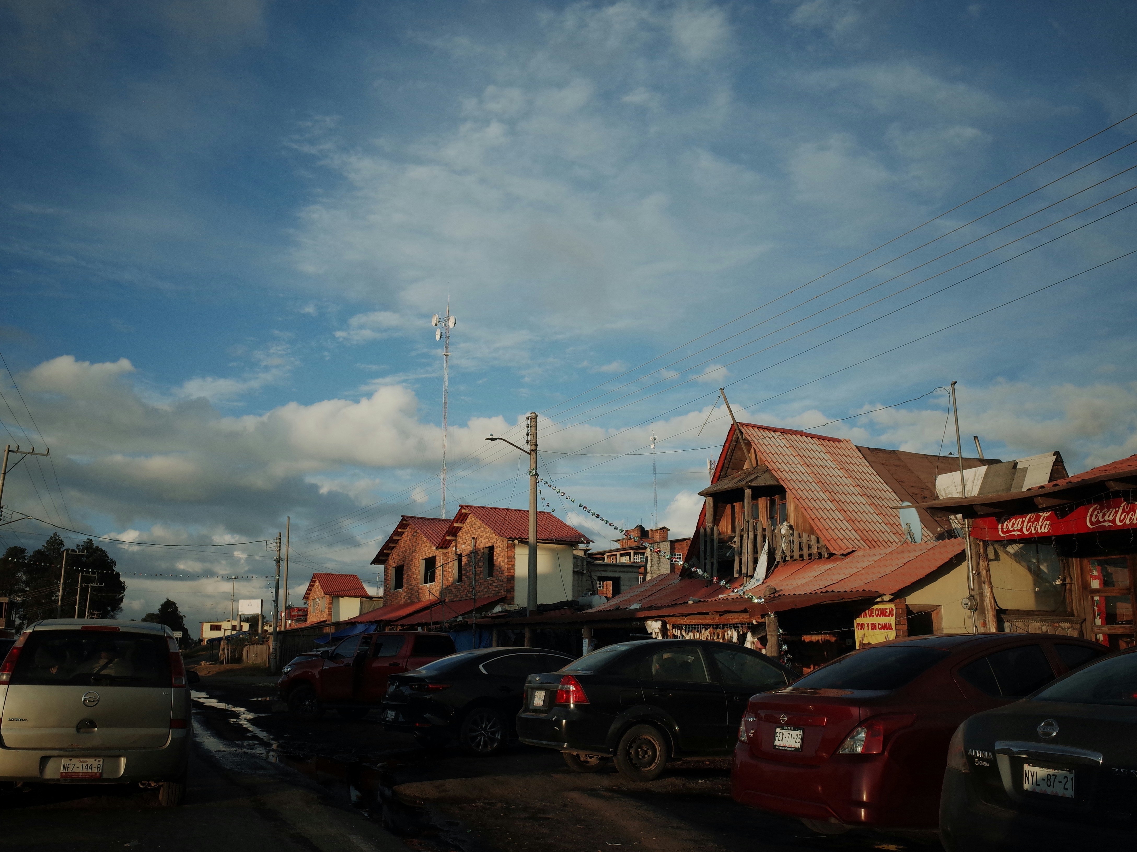 A parking lot filled with lots of parked cars