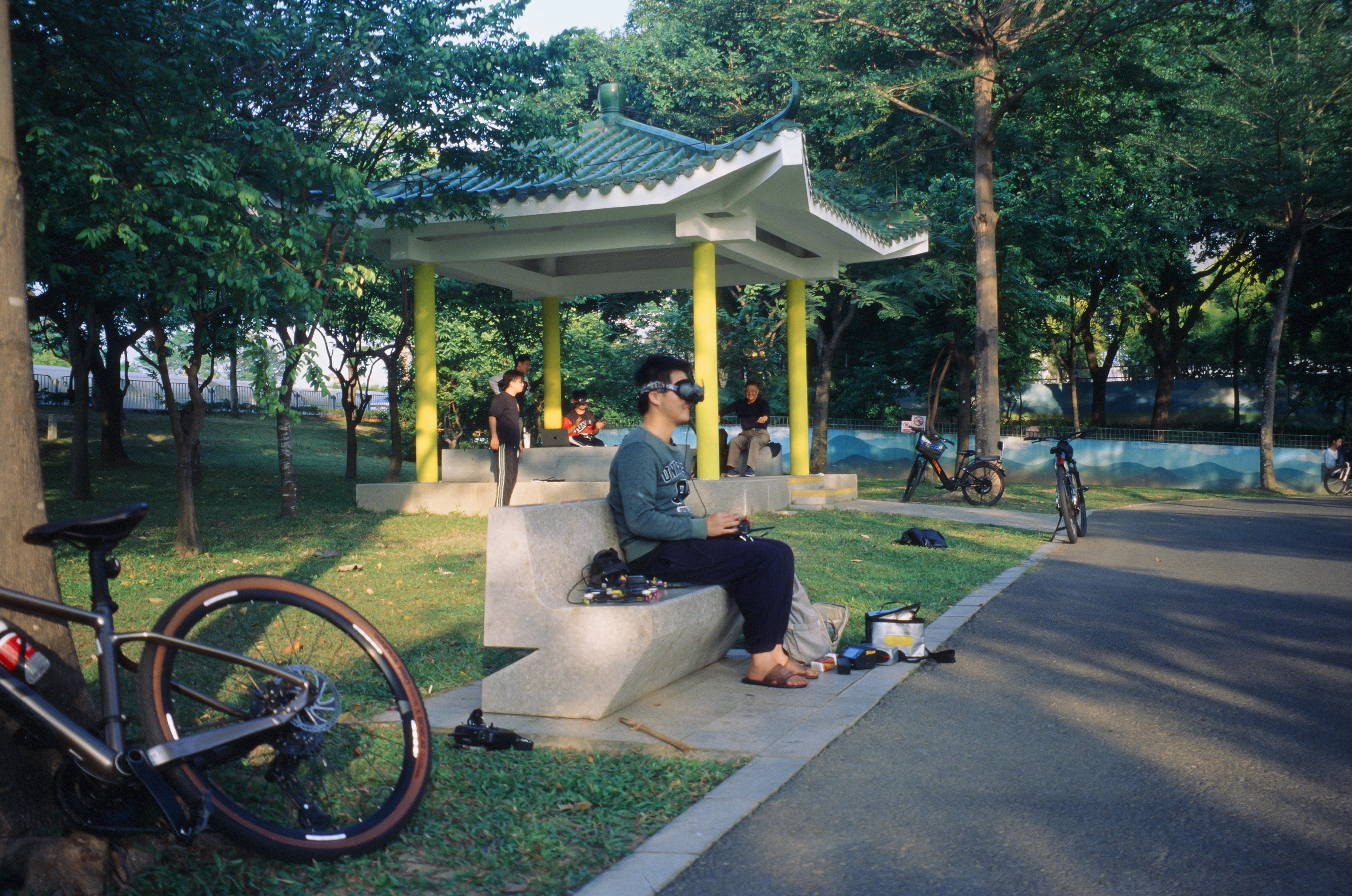 A small drone is likely equipped with a camera that allows the operator to see the drone's perspective in real time, enabling an immersive flying experience.