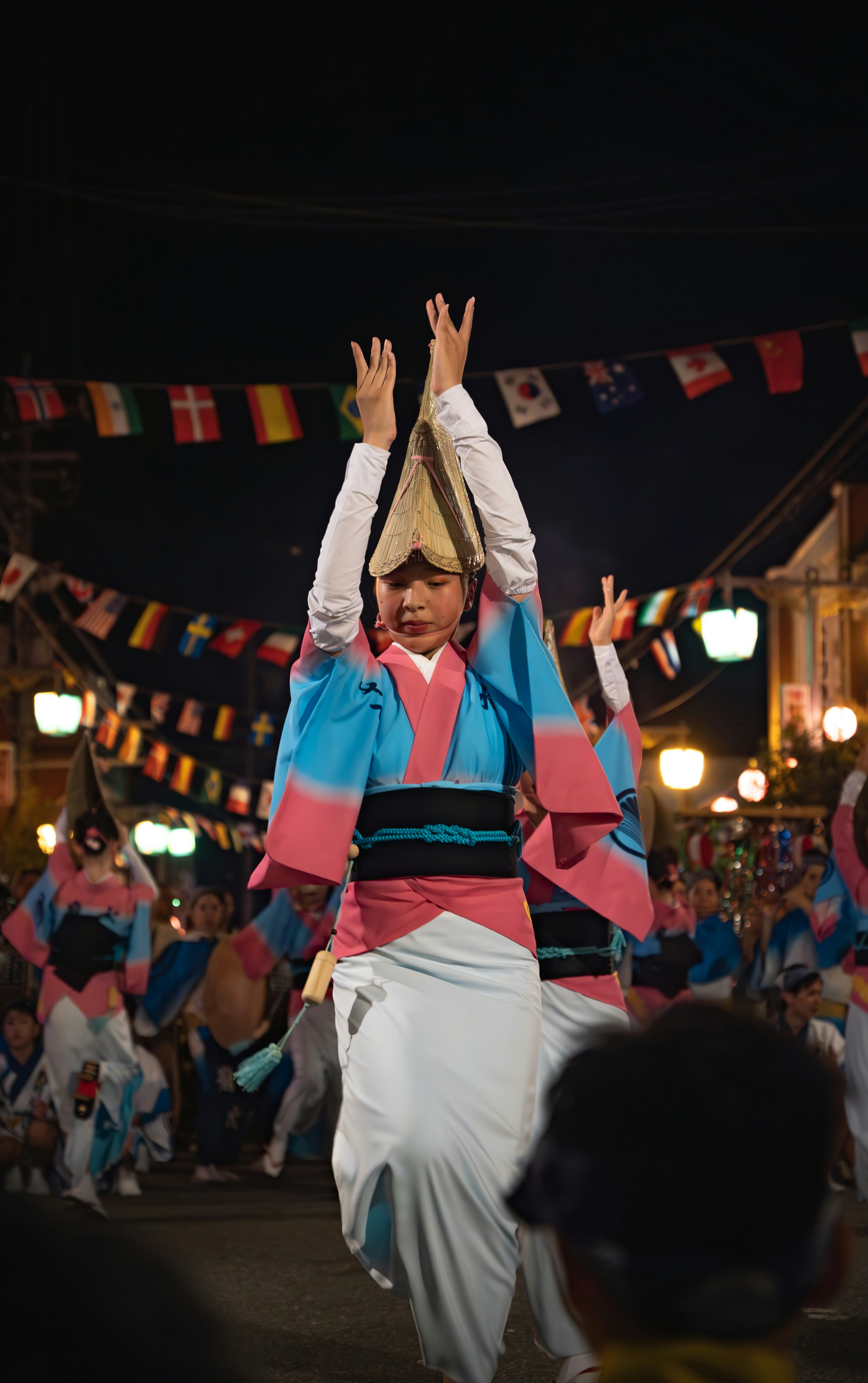 A group of people that are standing in the street