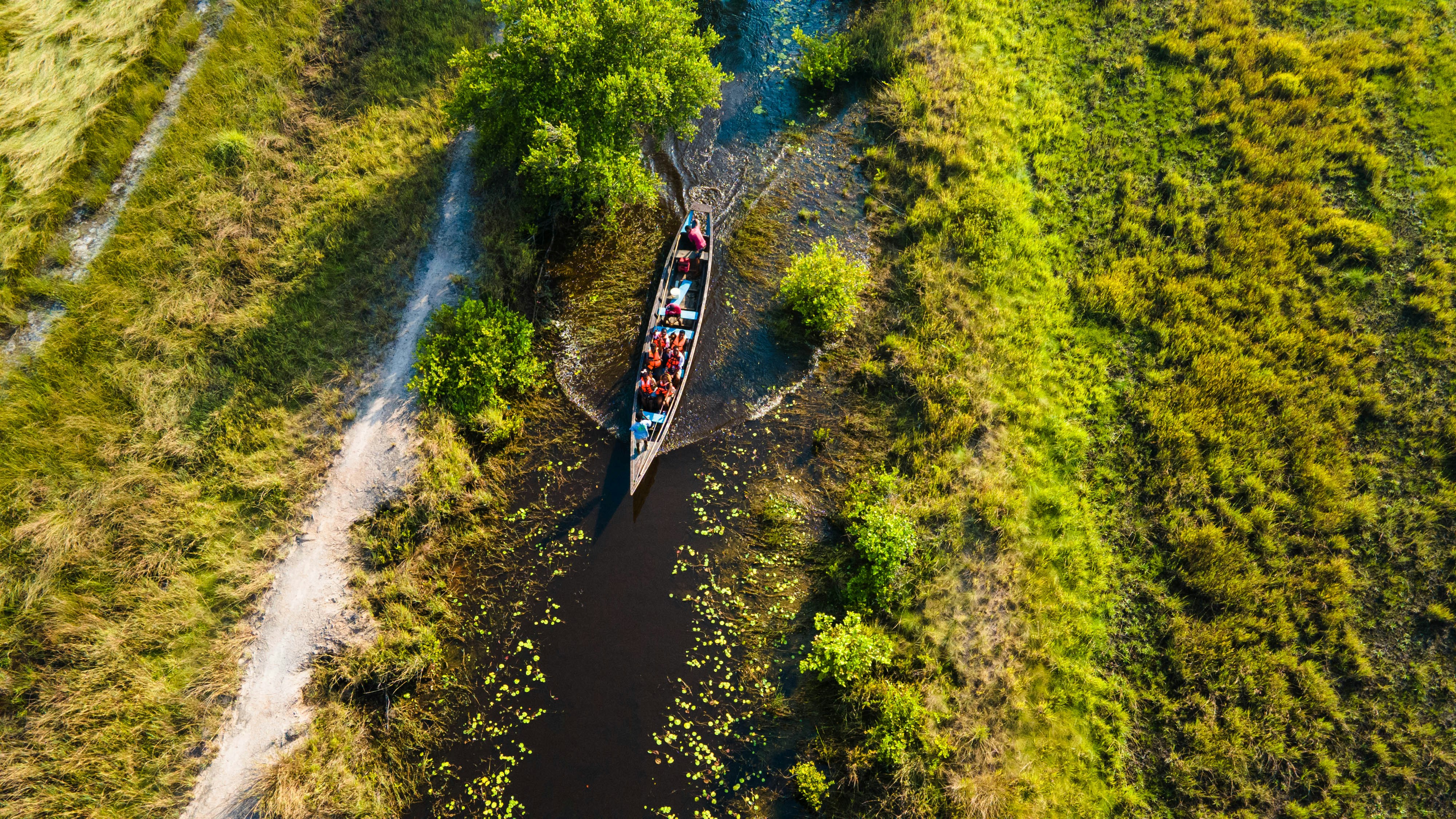 An aerial view of a boat on a river
