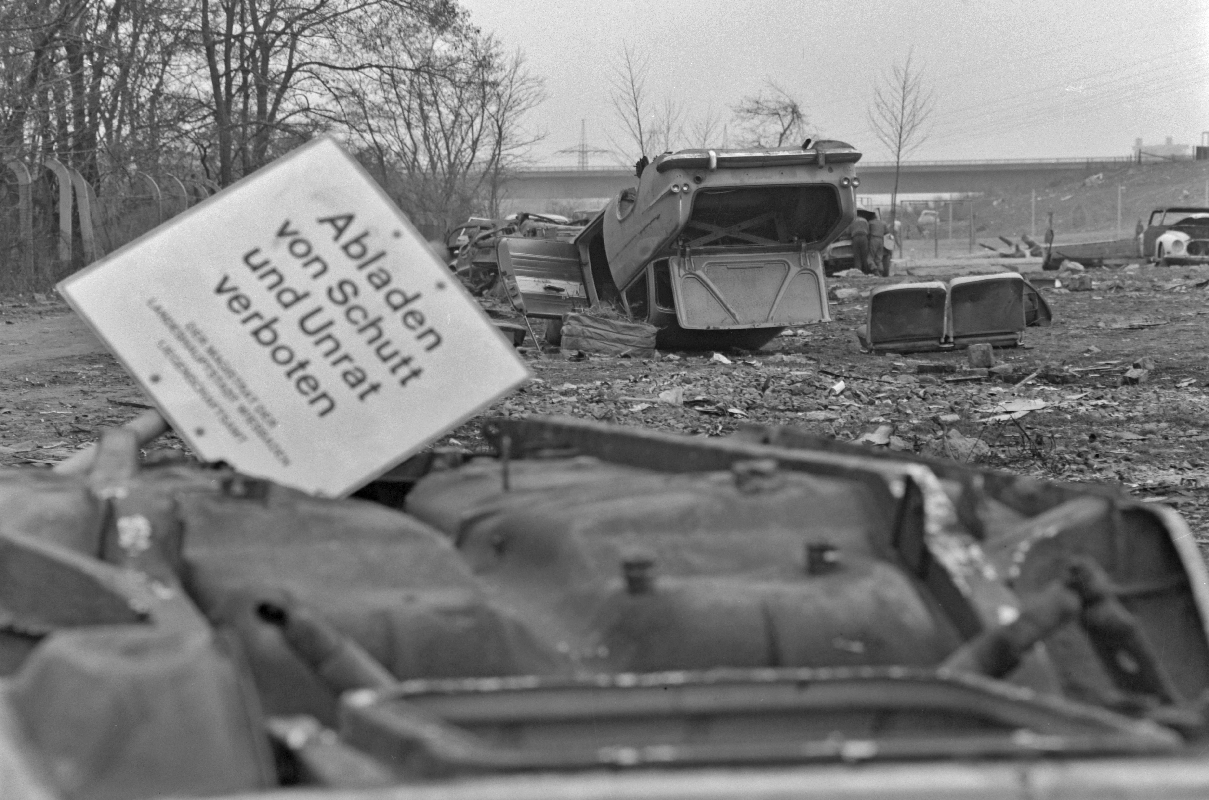 A black and white photo of a wrecked car