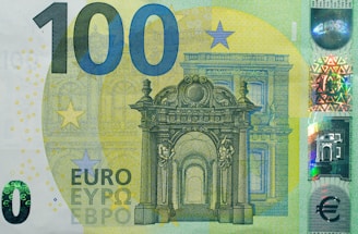 A paper money bill with a picture of a building on it