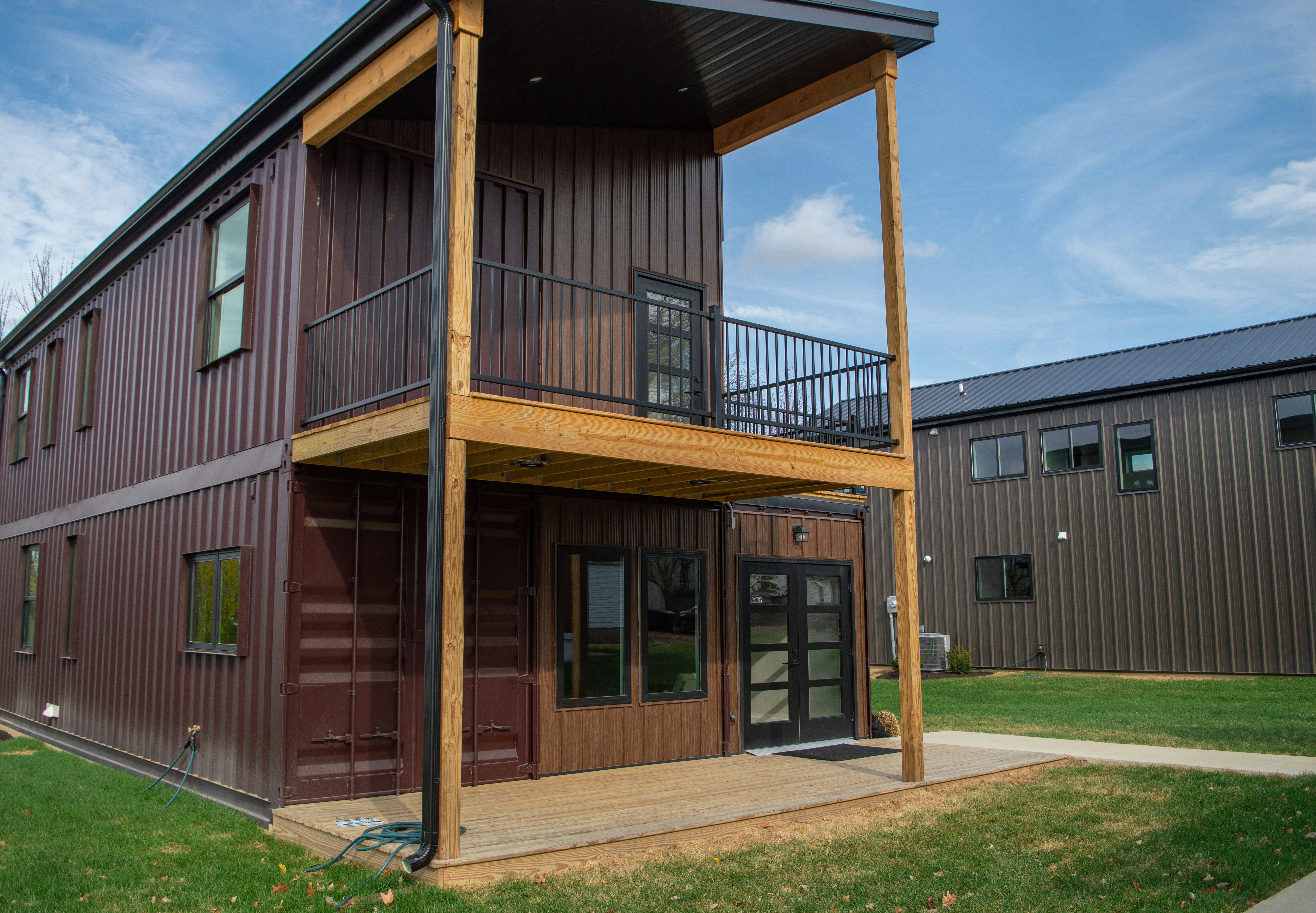 A two story building with a covered porch