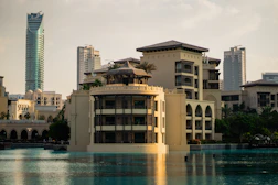 A large body of water with buildings in the background