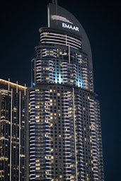A very tall building with some lights on top of it