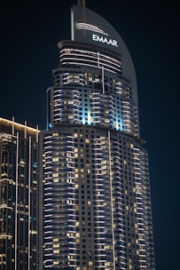 A very tall building with some lights on top of it