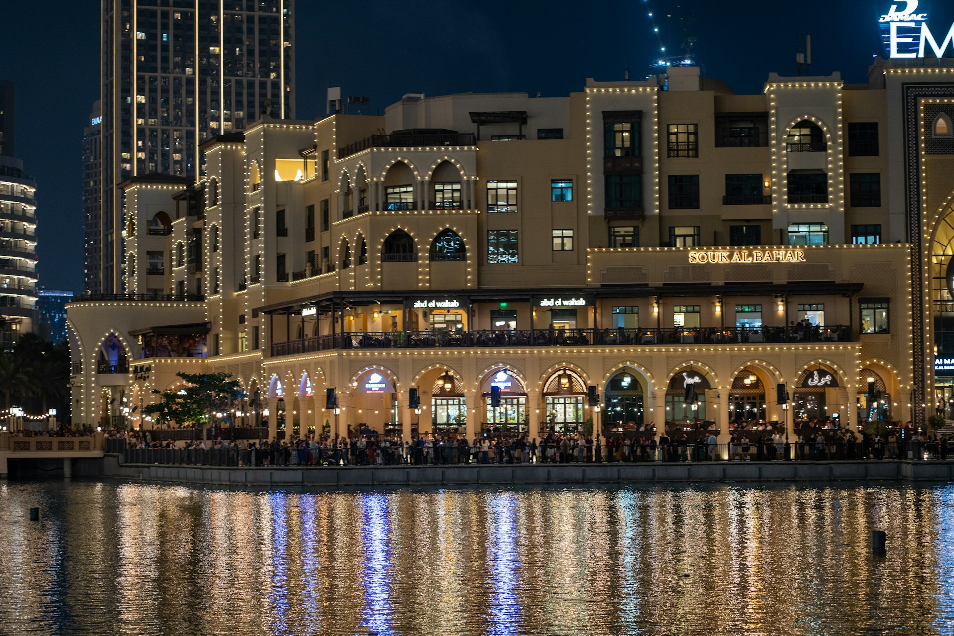 A large building sitting next to a body of water