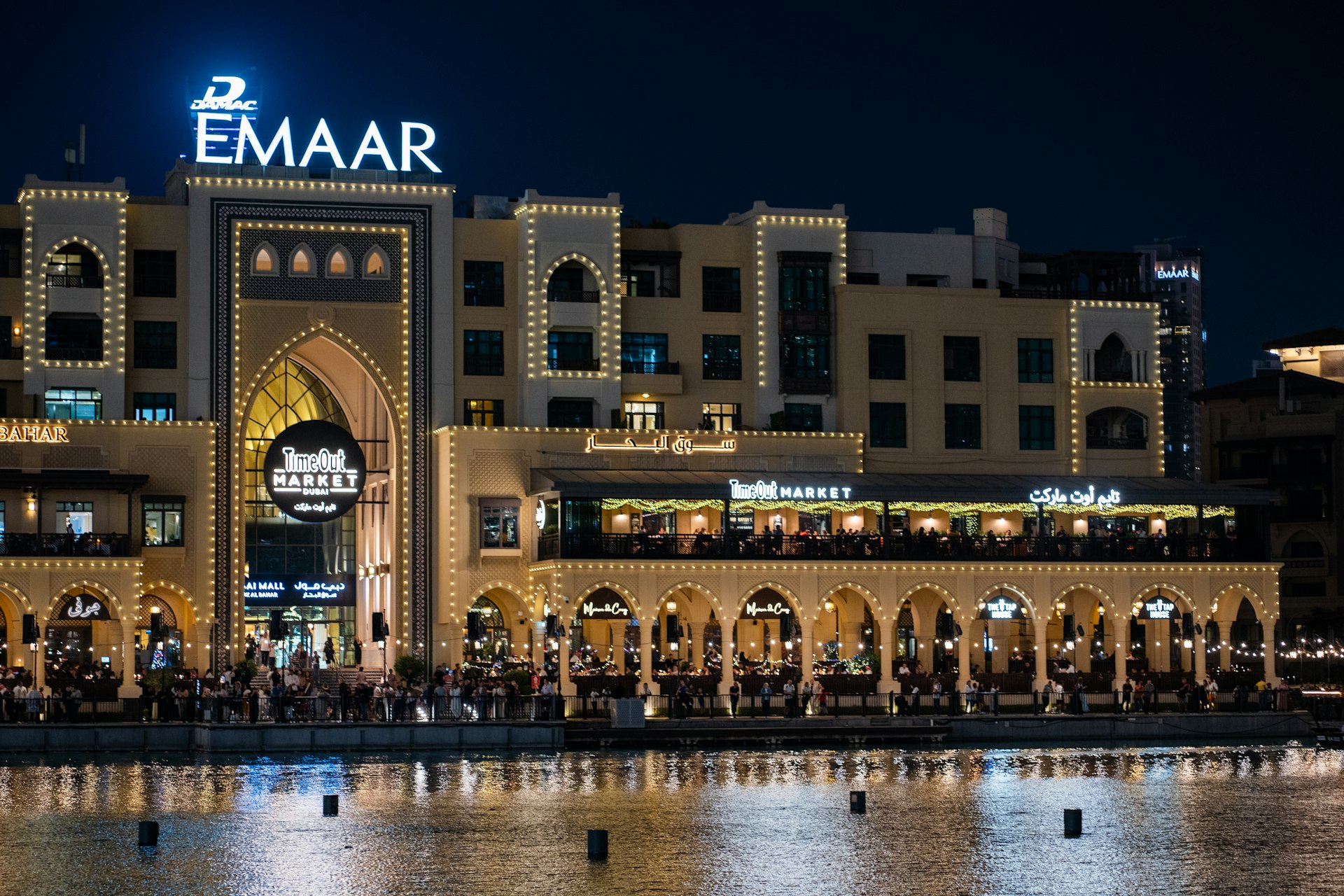 A large building sitting next to a body of water