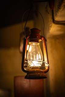 A lantern hanging from the side of a building
