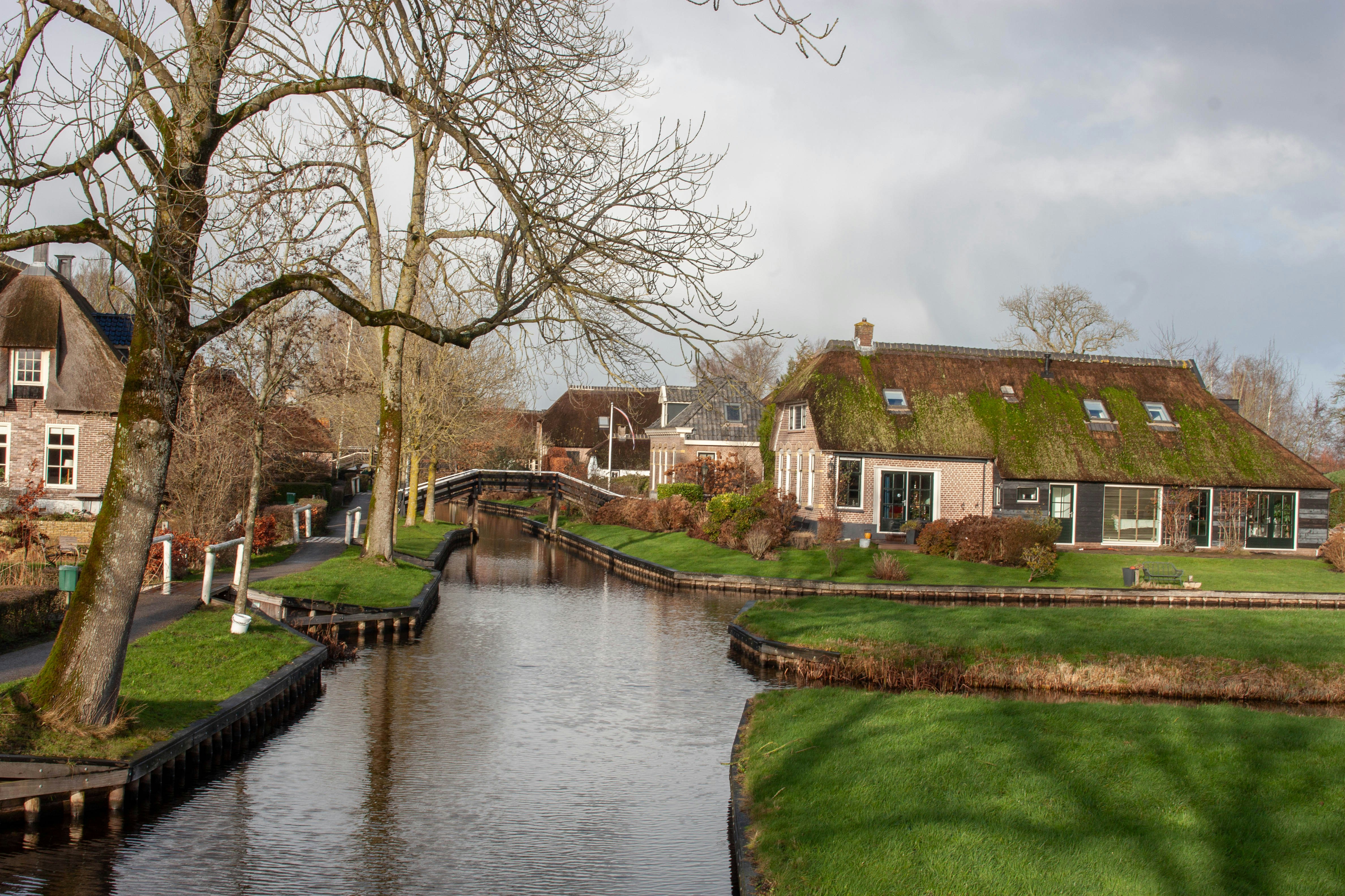 A river running through a lush green countryside