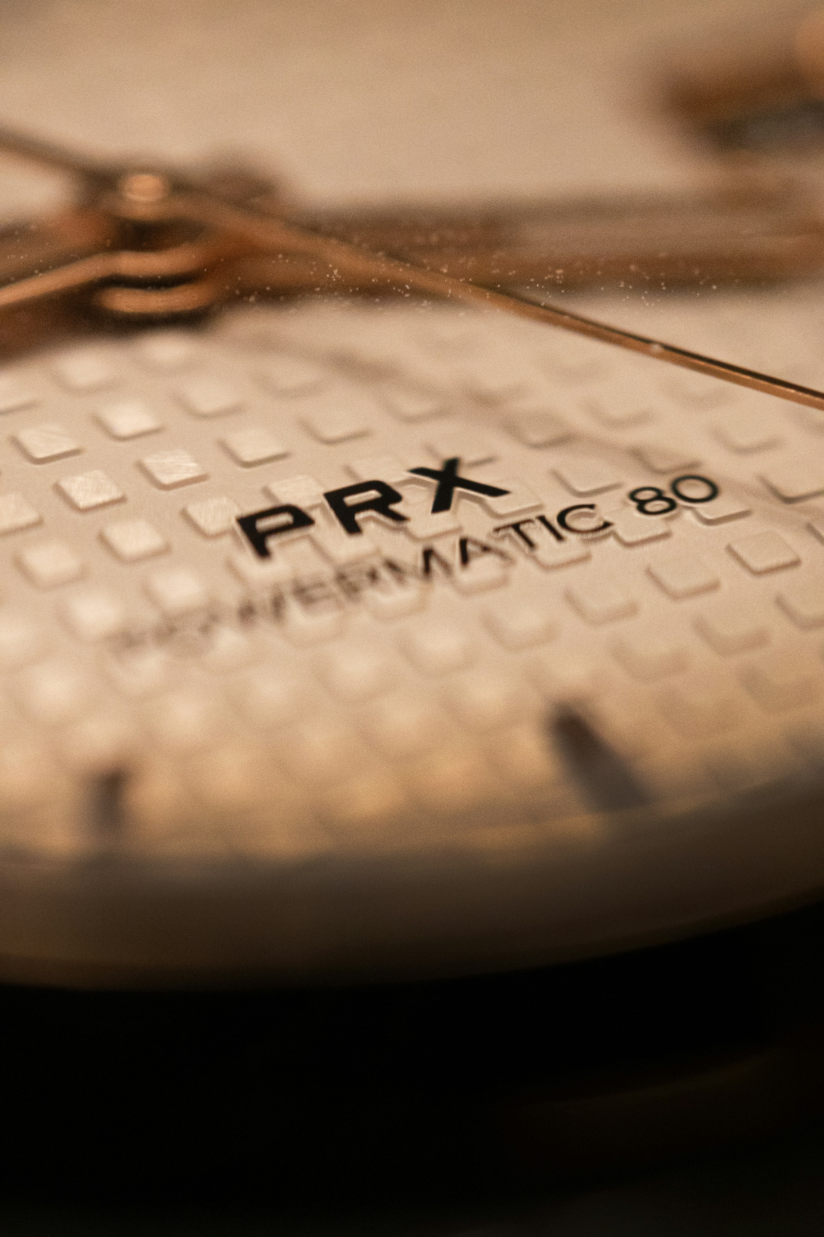 A close up of a watch face with the date on it