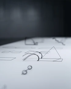 A close up of a piece of paper with a pen on it