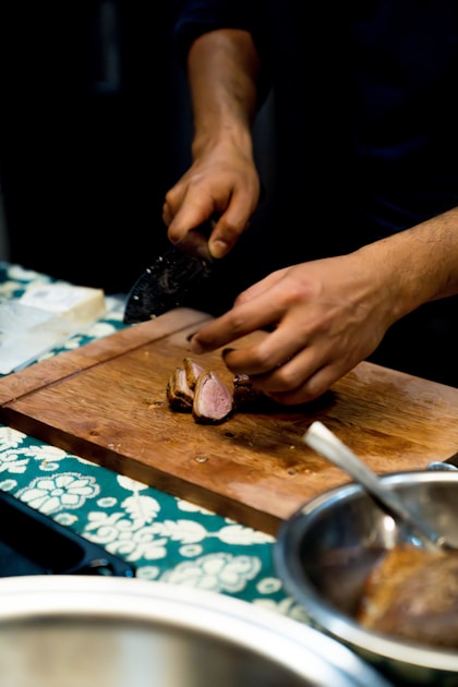 Hunter field dressing a deer in the woods after a successful harvest