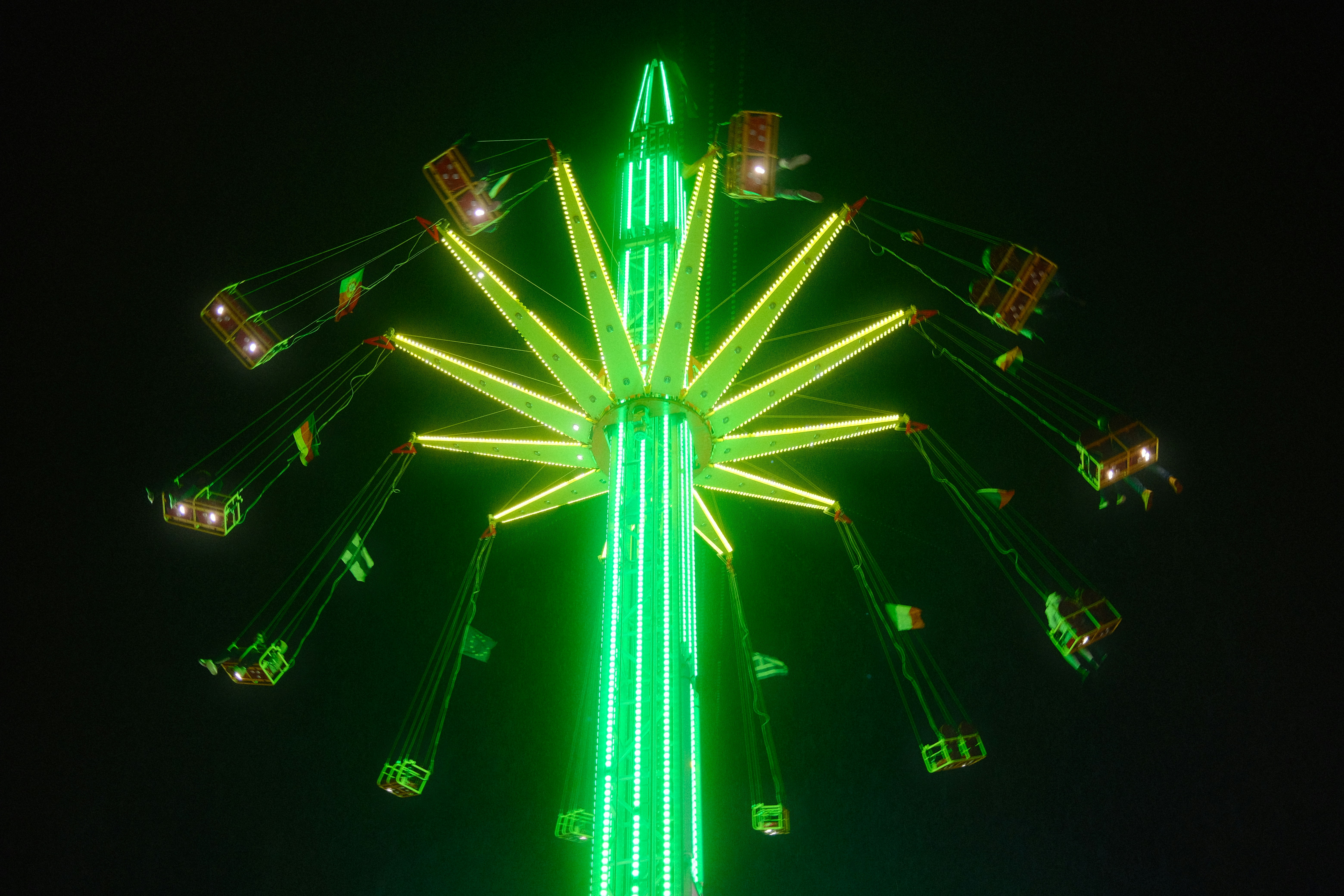 Neon carnival ride at night