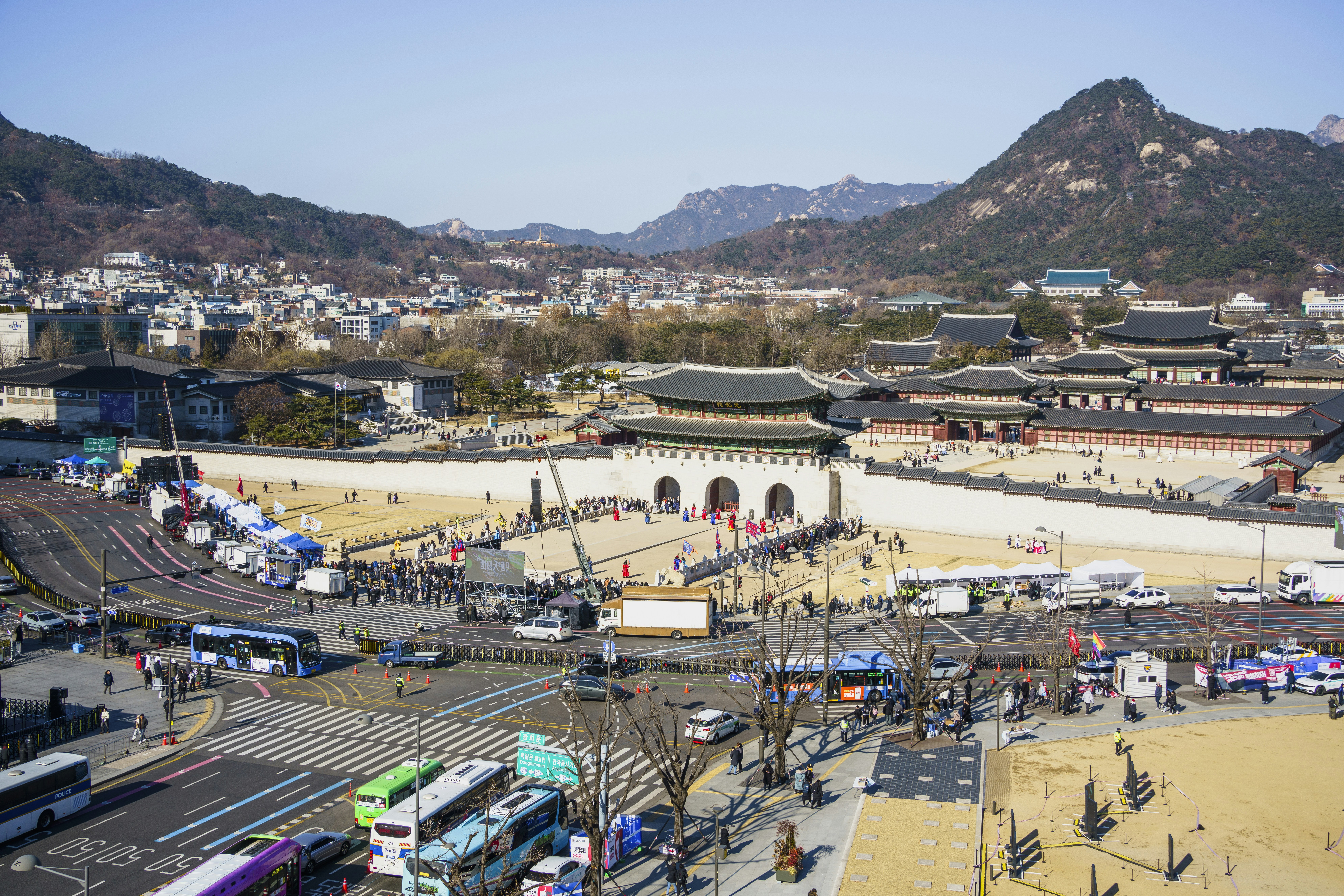 An aerial view of a city with mountains in the background