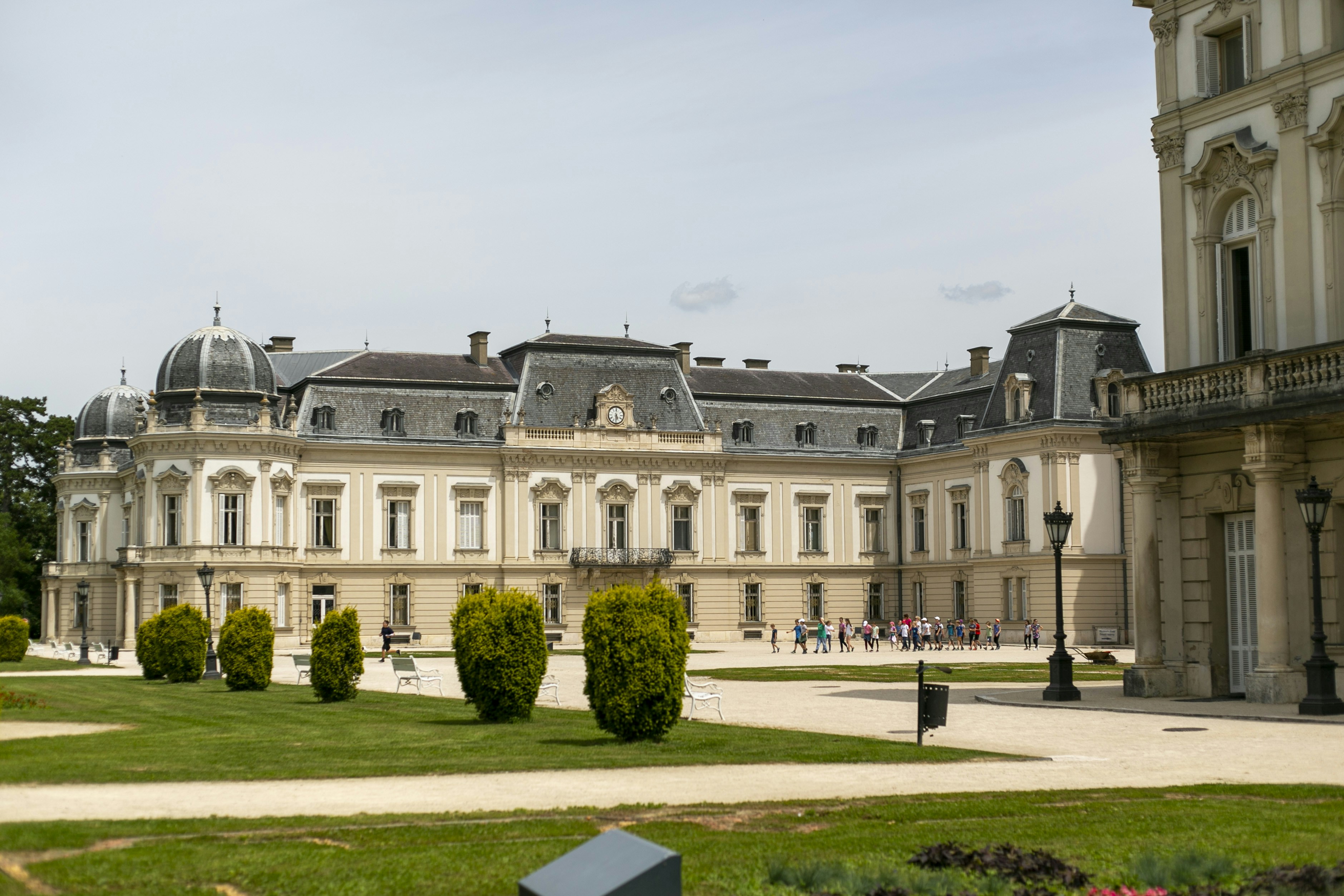 A large building with a lot of trees in front of it