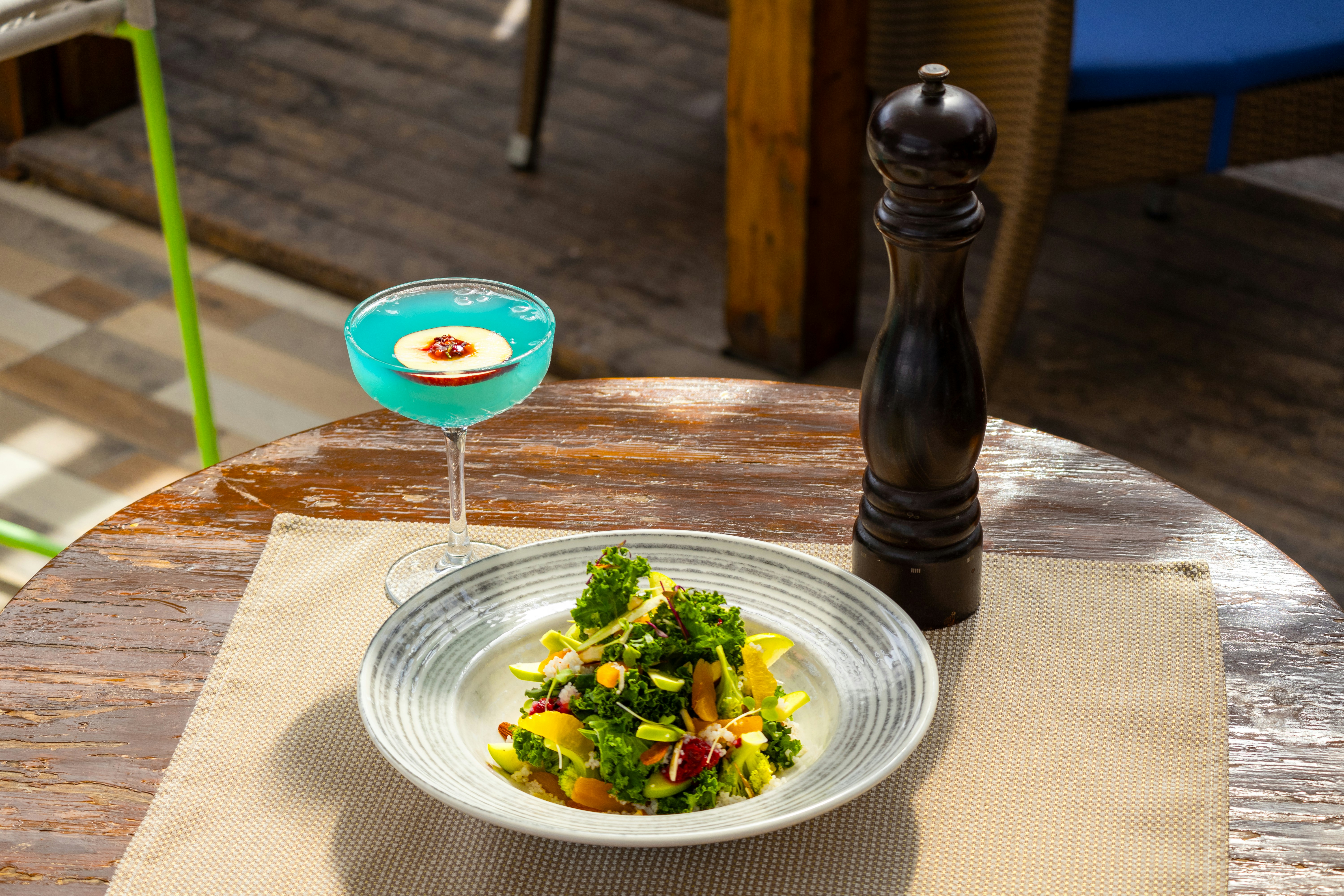 A plate of food on a table with a drink
