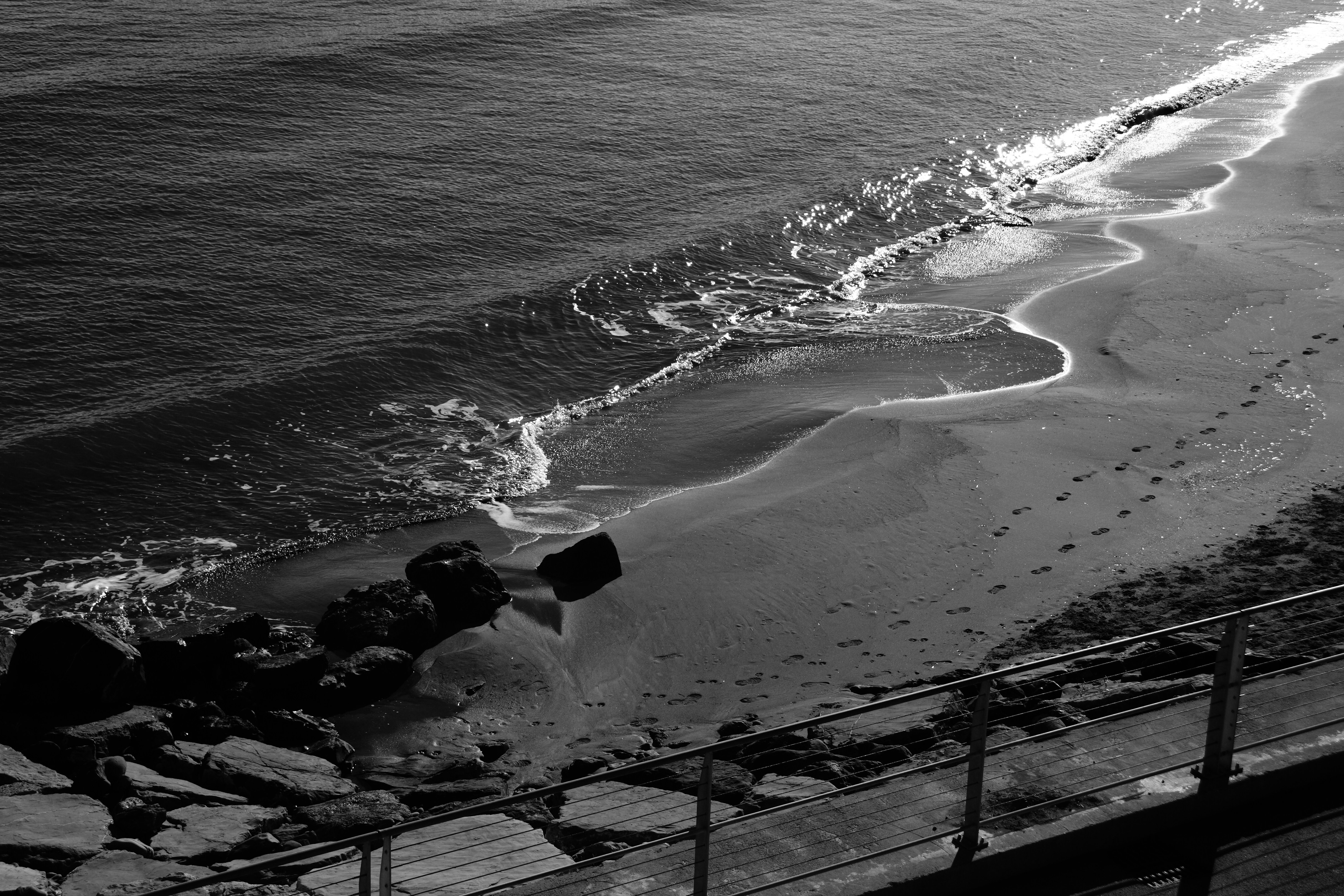 A black and white photo of a beach