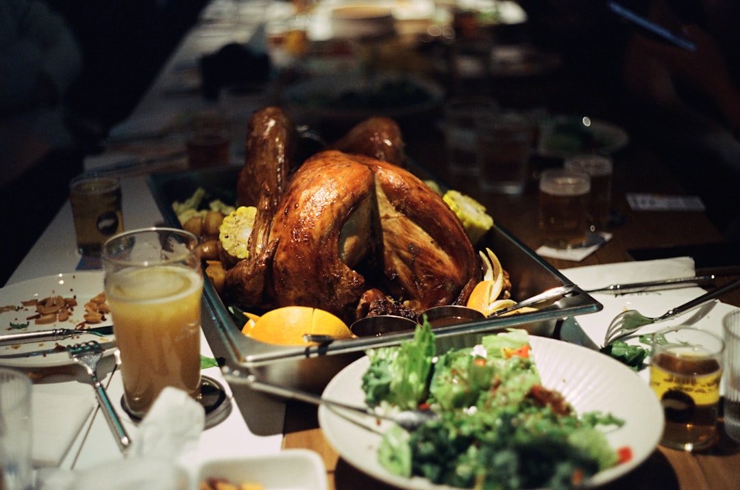 A table filled with plates of food and a turkey, shot on Kodak Vision3 500T