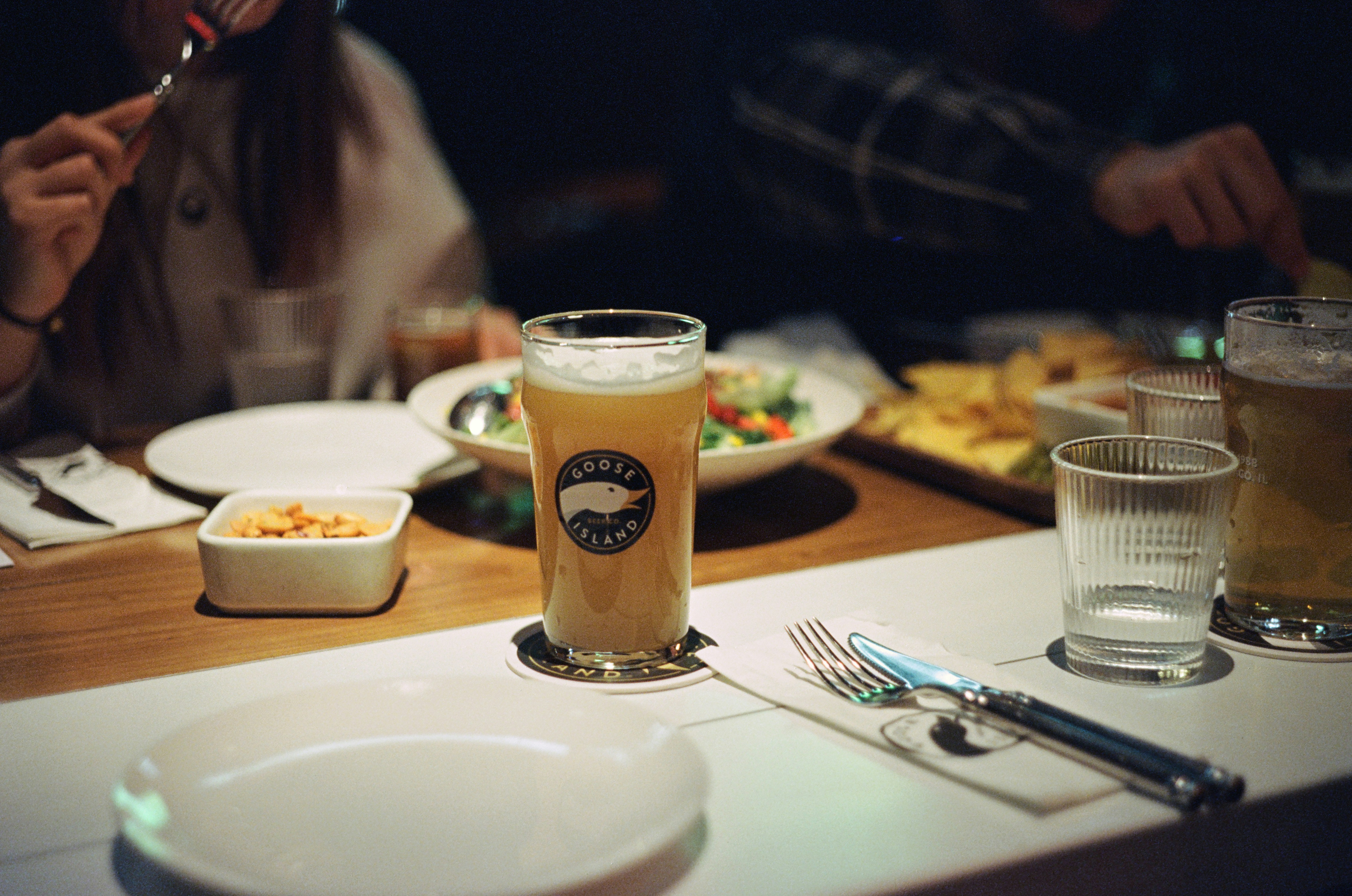 A group of people sitting around a table eating food
