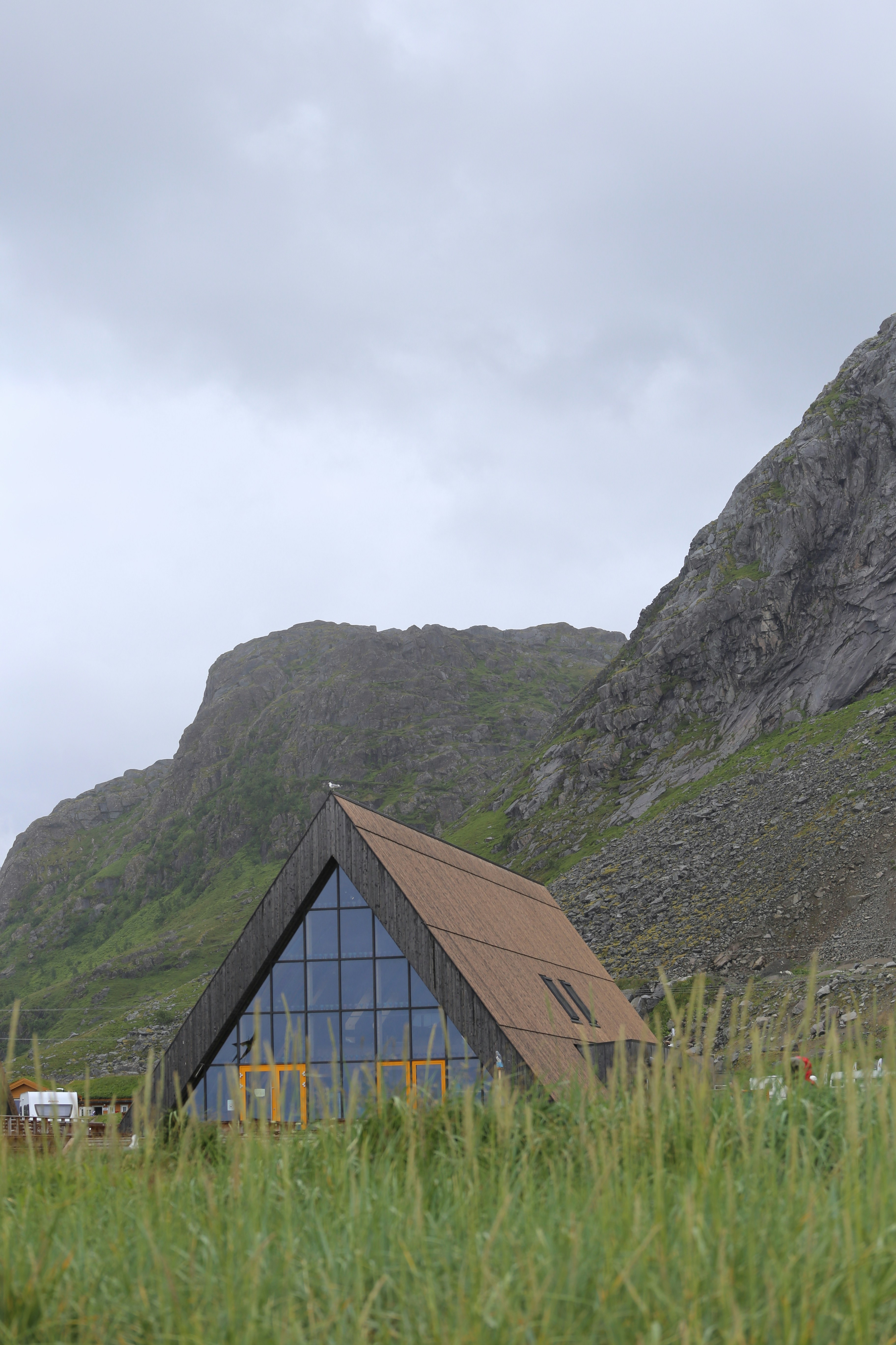 A building with a mountain in the background
