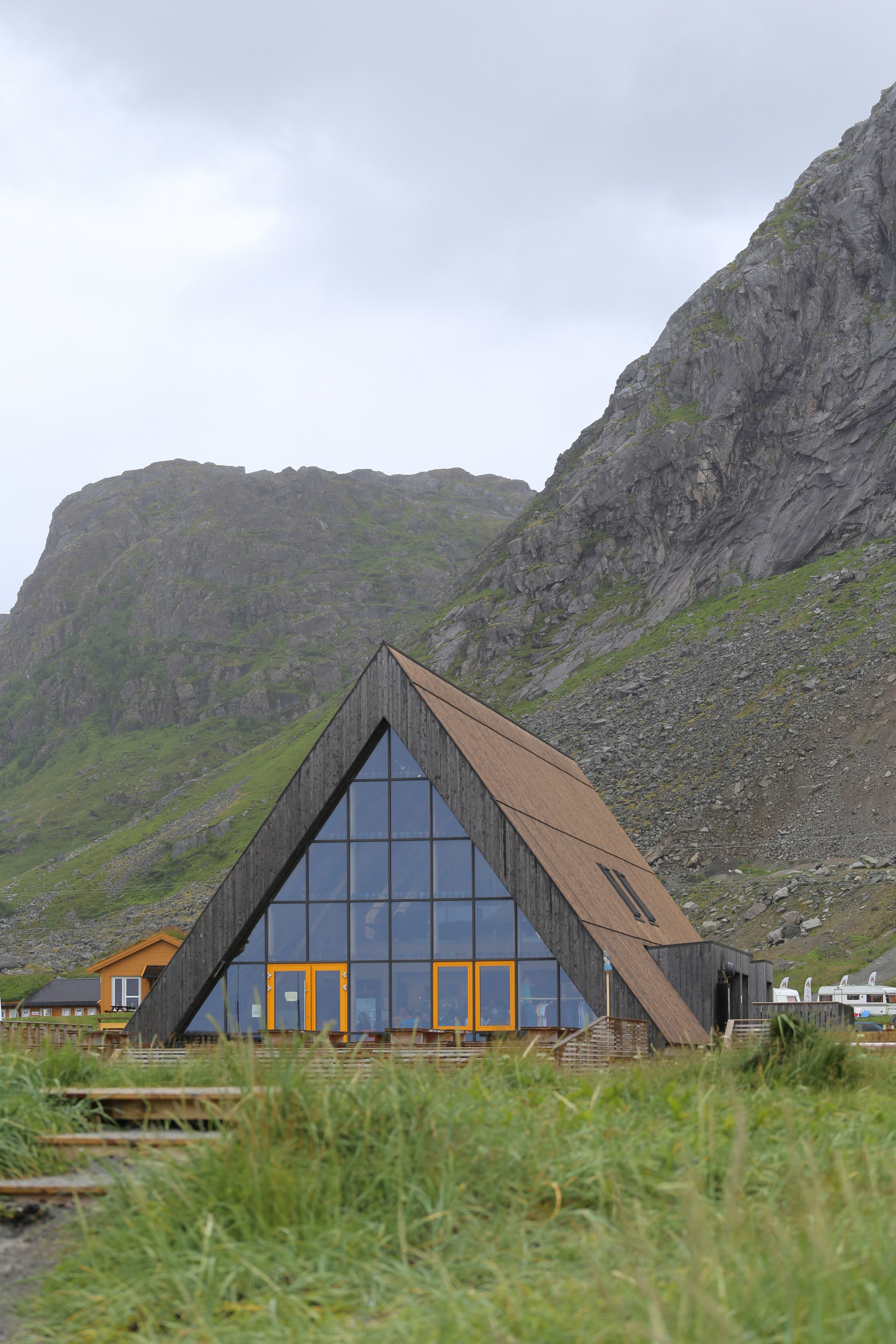 A building with a mountain in the background
