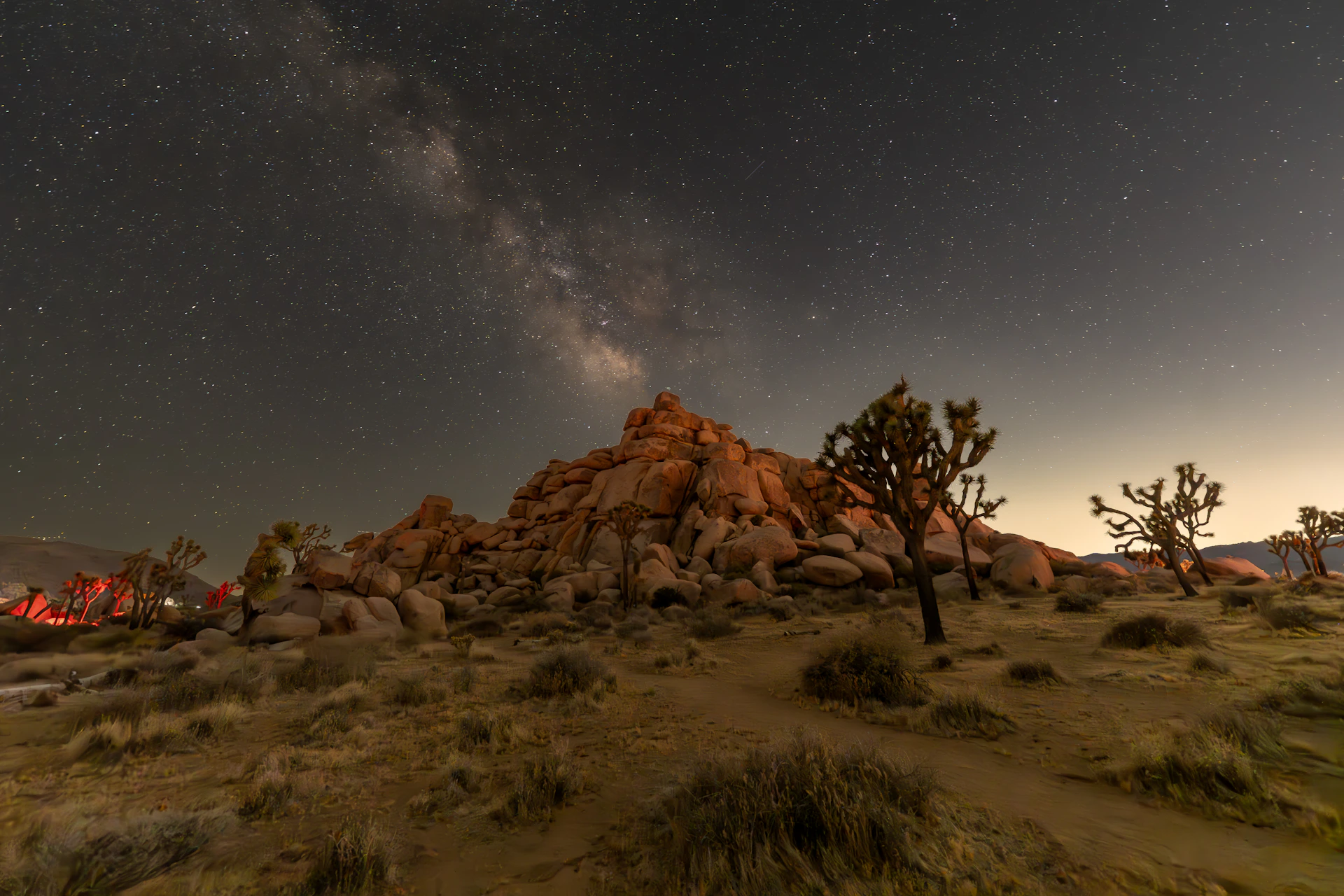 The night sky is full of stars and stars above the desert