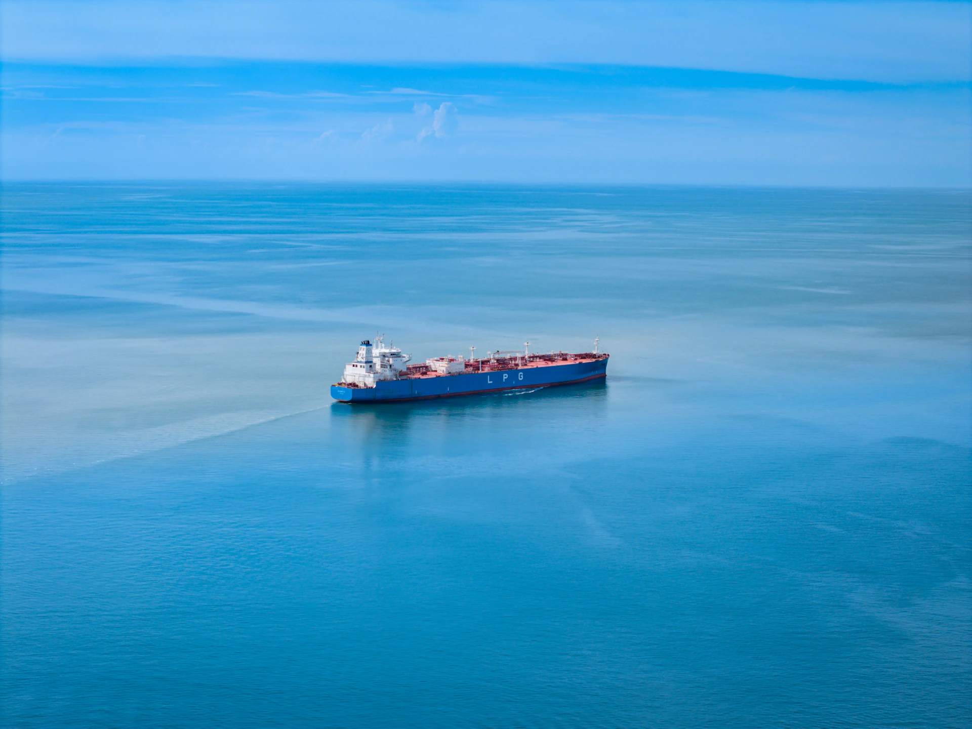 A large boat floating on top of a large body of water