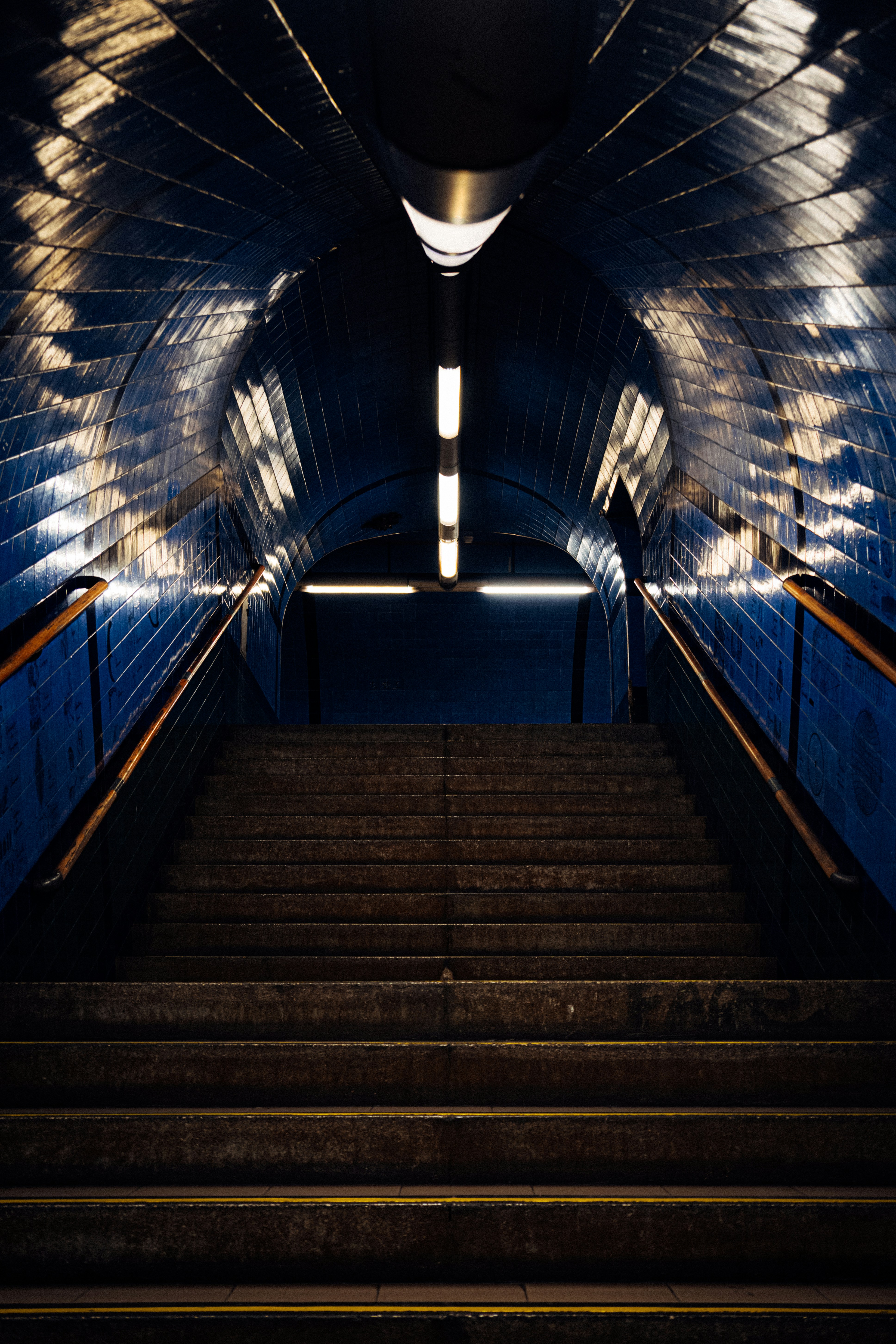 A set of stairs leading up to a tunnel