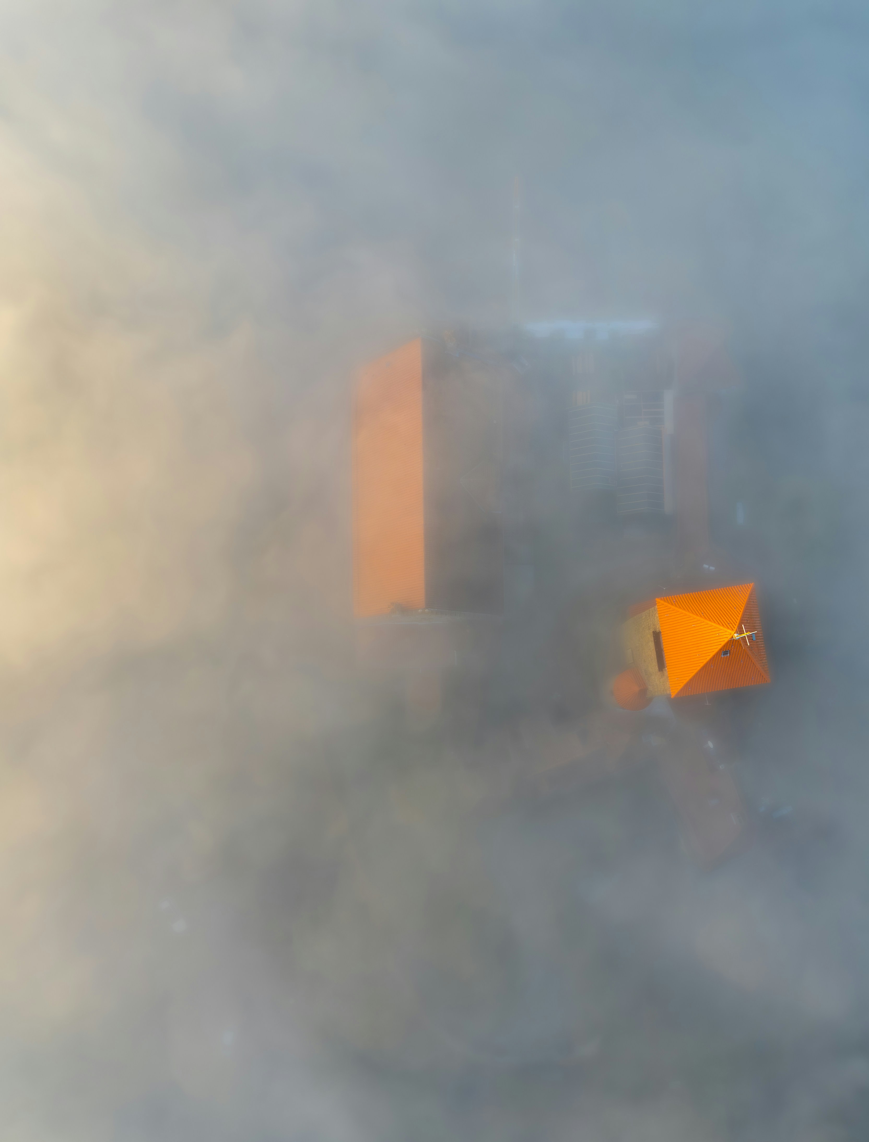 An orange object in the middle of a cloud of smoke