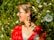 A woman standing in a field of flowers
