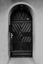 A black and white photo of a door