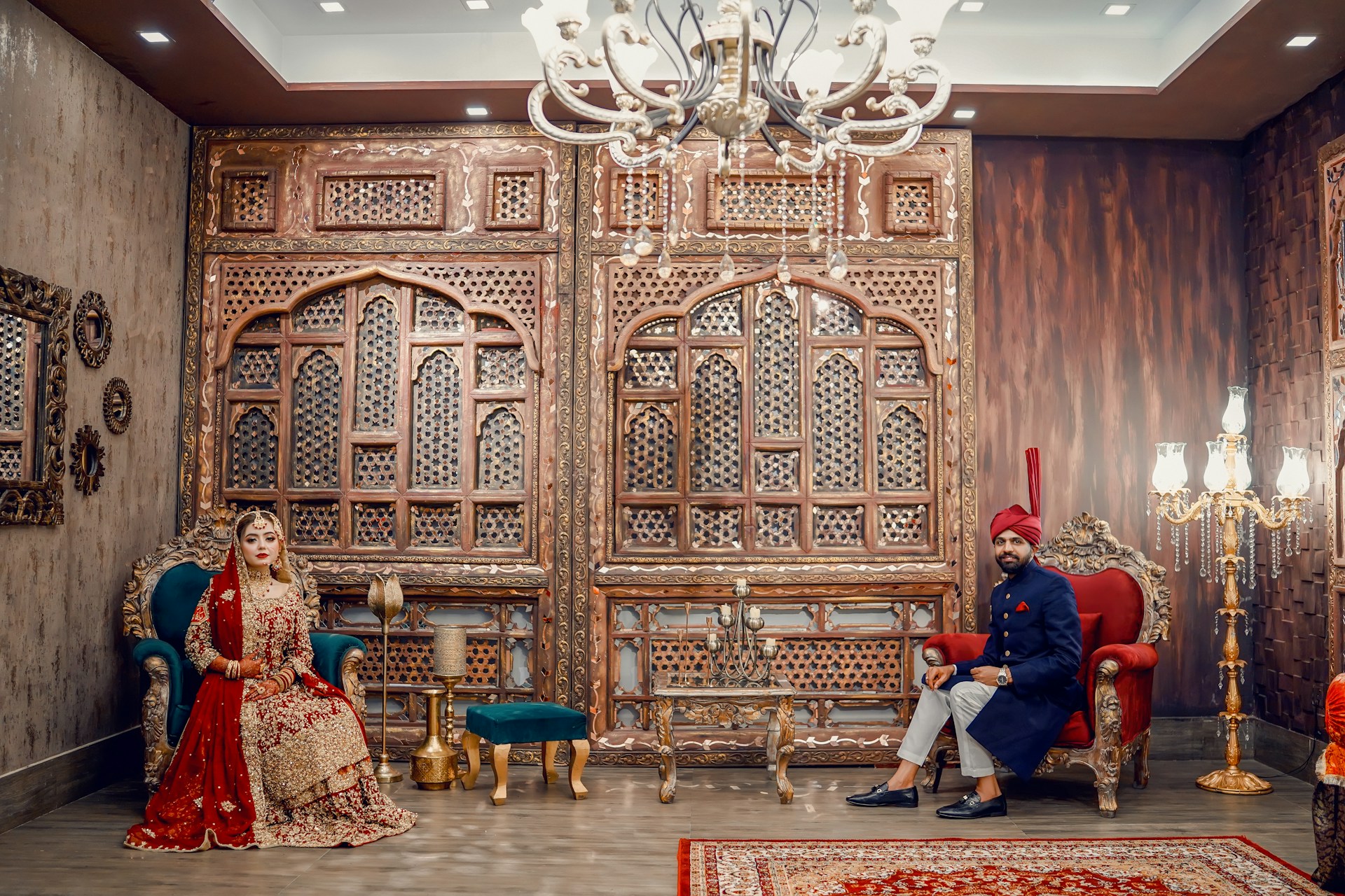 A man and a woman sitting in chairs in a room