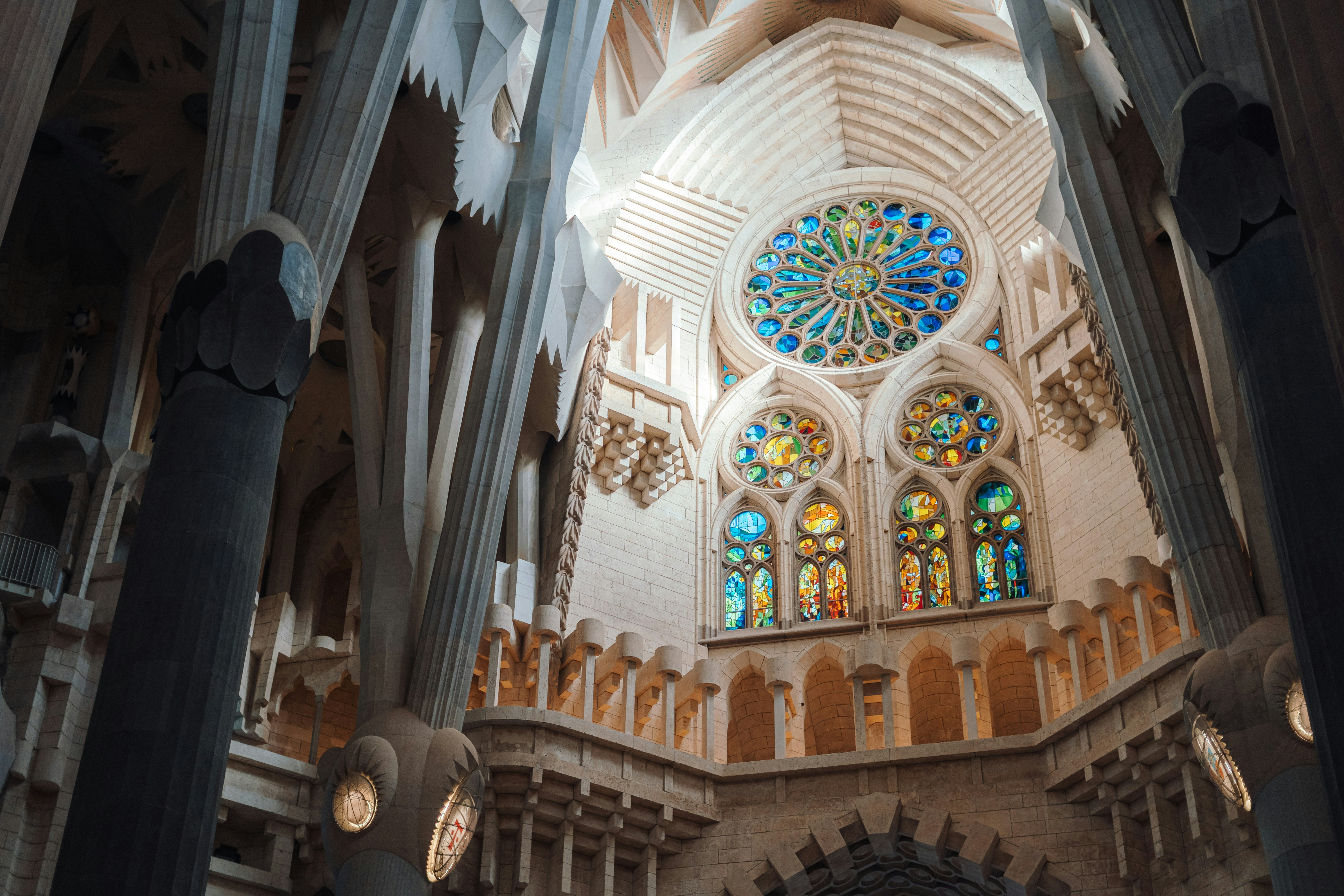 The inside of a cathedral with stained glass windows