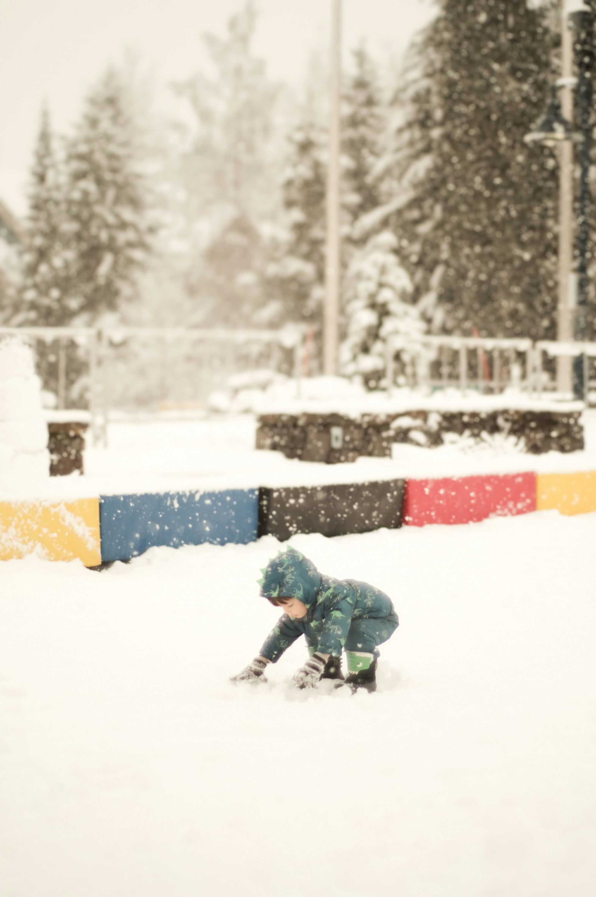 A person kneeling down in the snow