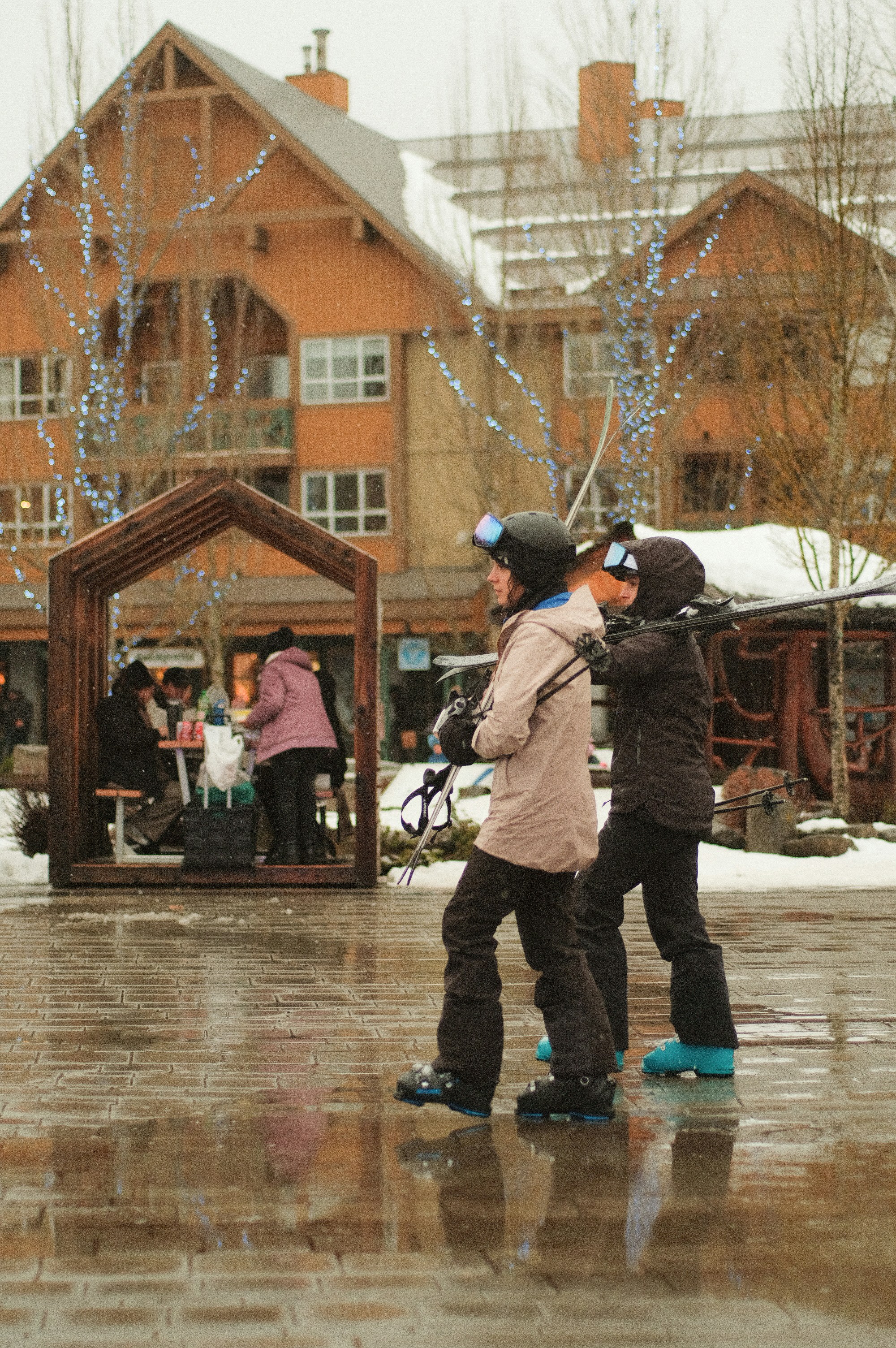 A couple of people that are standing in the snow