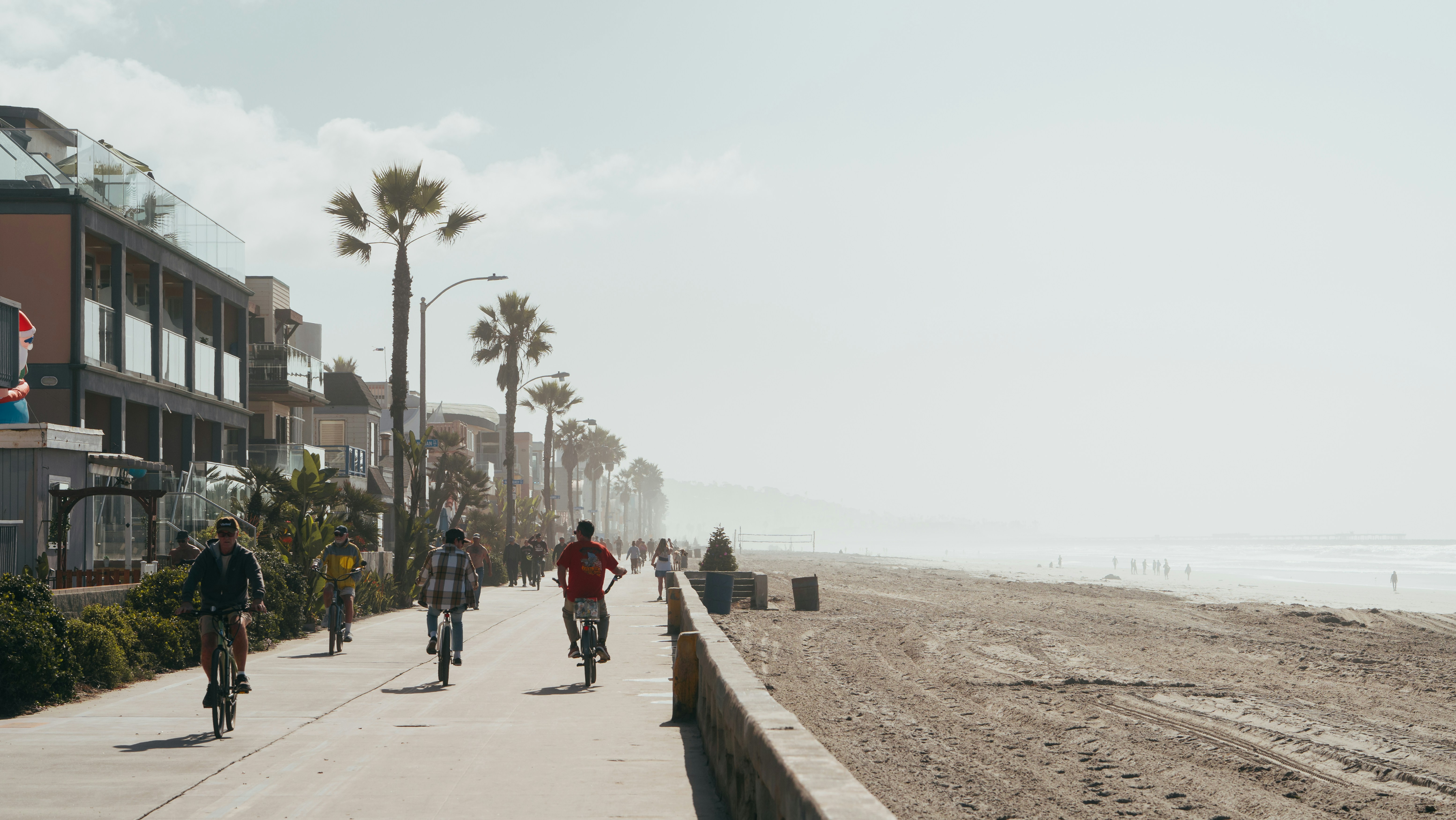 Family biking on a path near the beach - best family vacations spots​