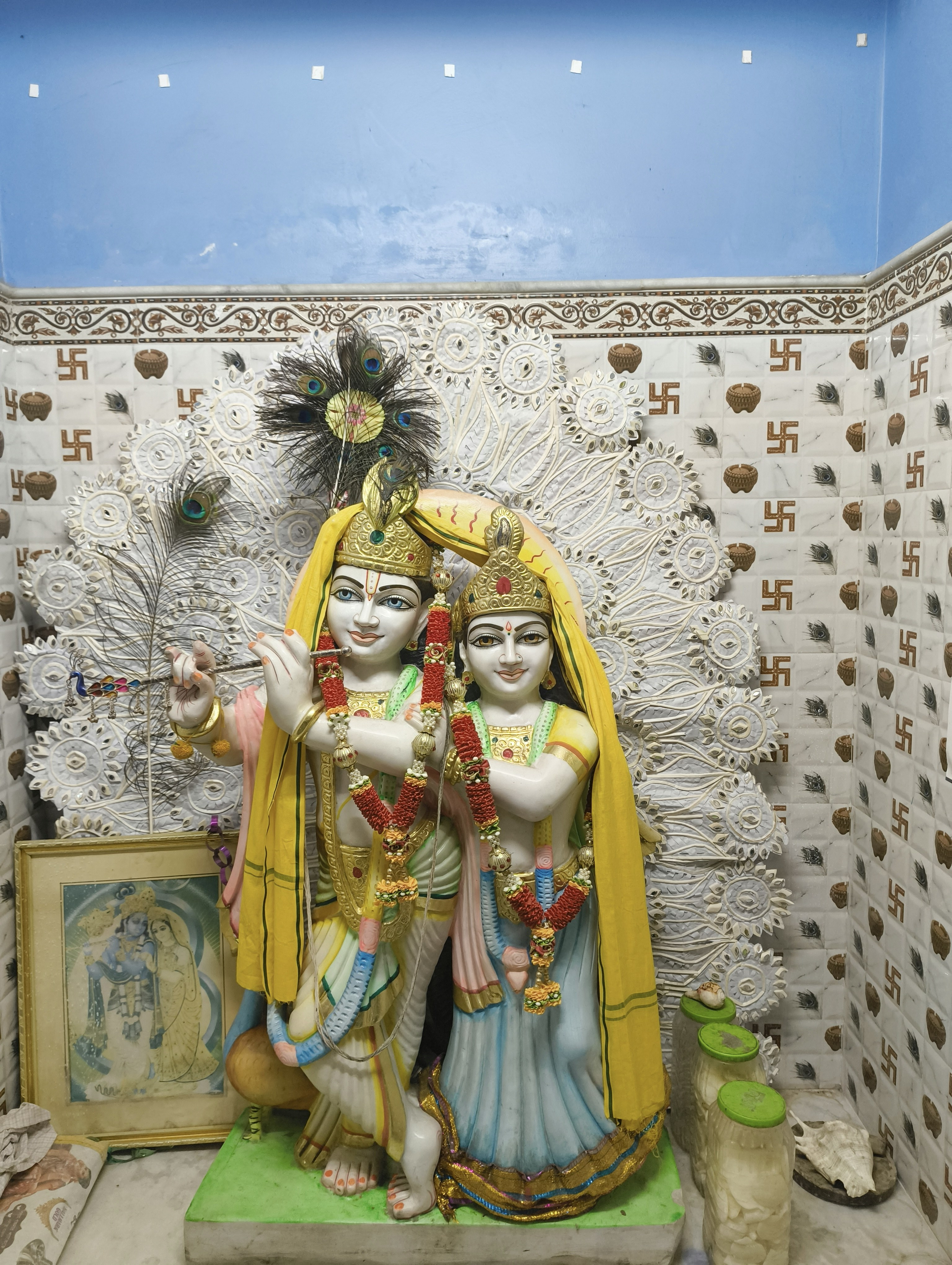 Pair of crystal quartz Radha and Krishna idols in divine embrace on marble base