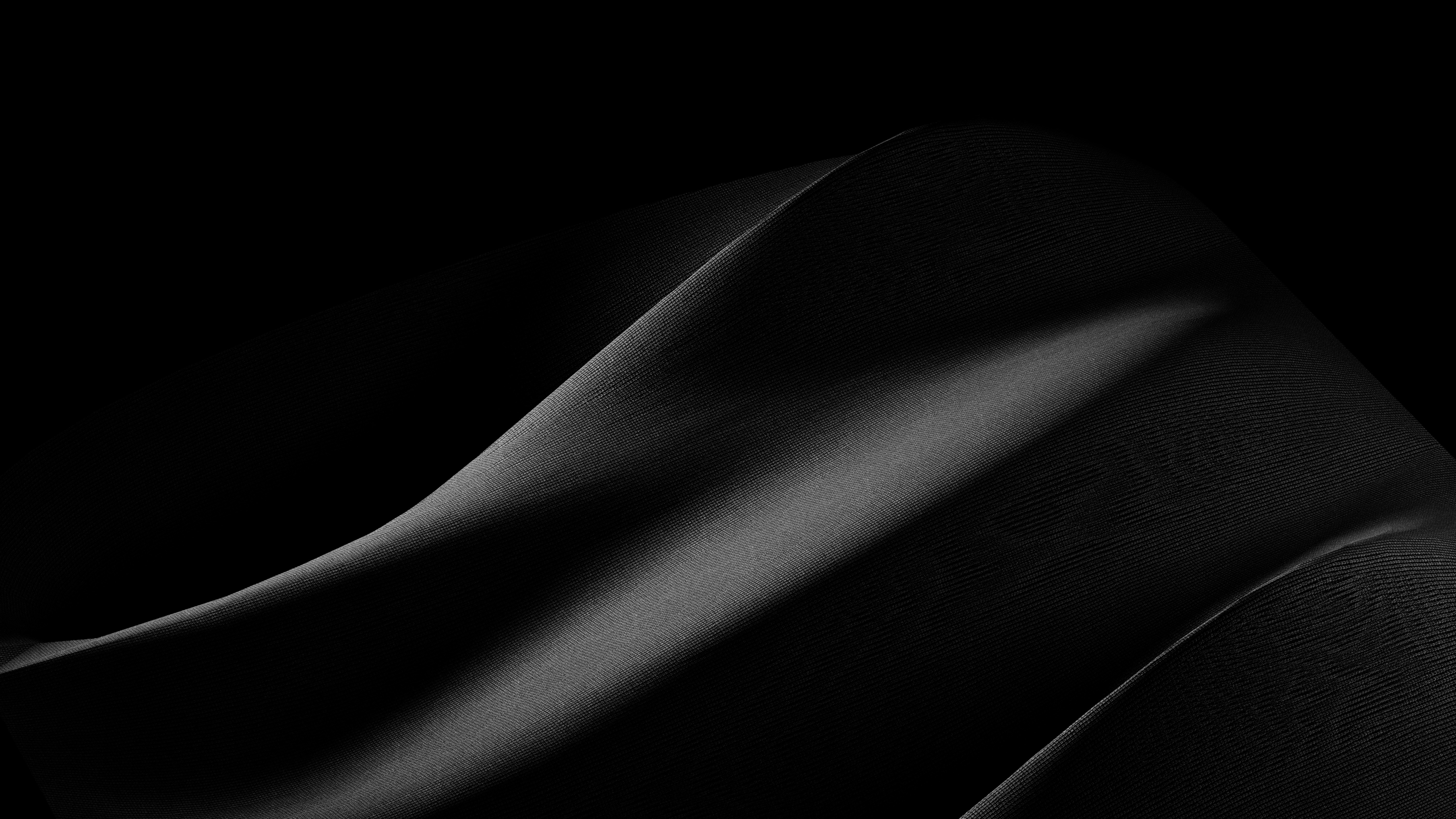 A black and white photo of a curved object