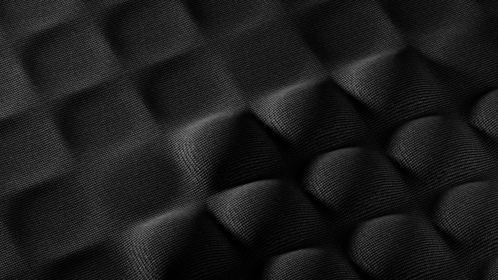 A black and white photo of a textured surface