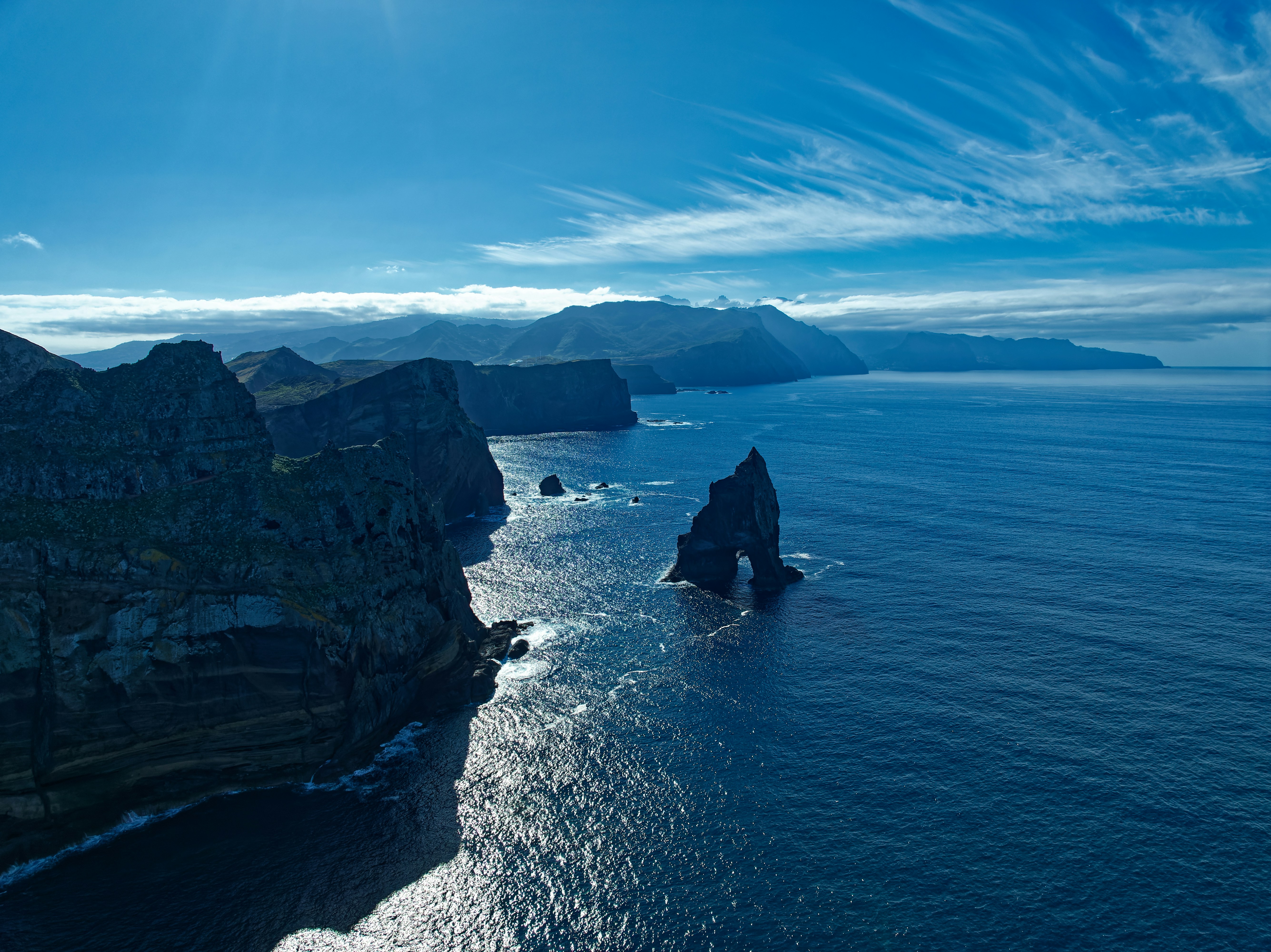 A large body of water surrounded by mountains